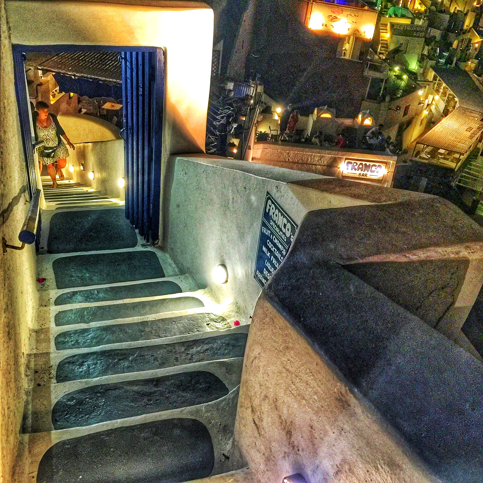 The restaurants are either up a staircase or down a stair case hanging over the caldera. No matter where you eat if you're on the last street in the town the views will be spectacular. 