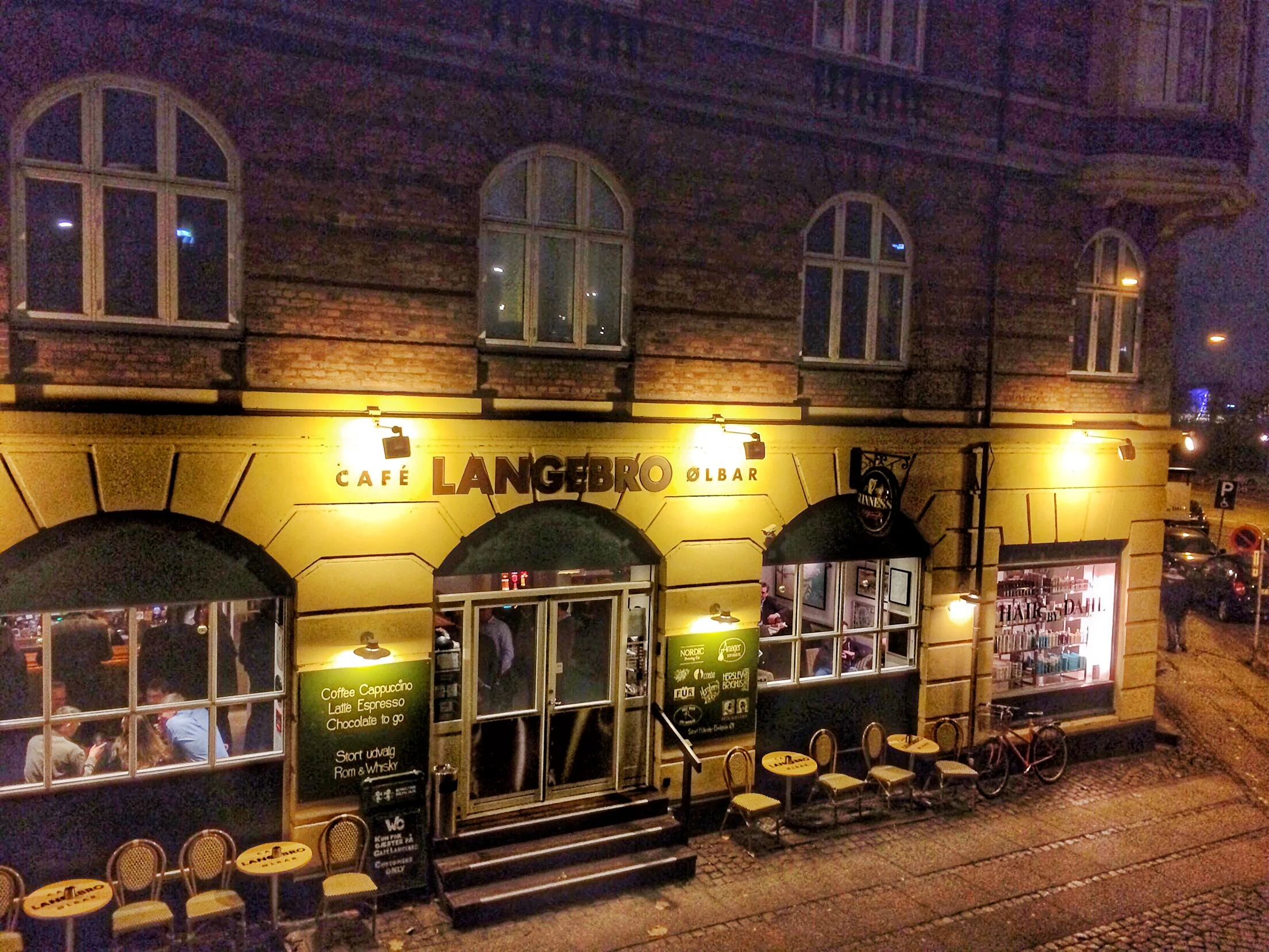 Cafe Langebro is located right under the Langebro bridge along Islands Brygge and the canal, Kobenhavns Havn.
