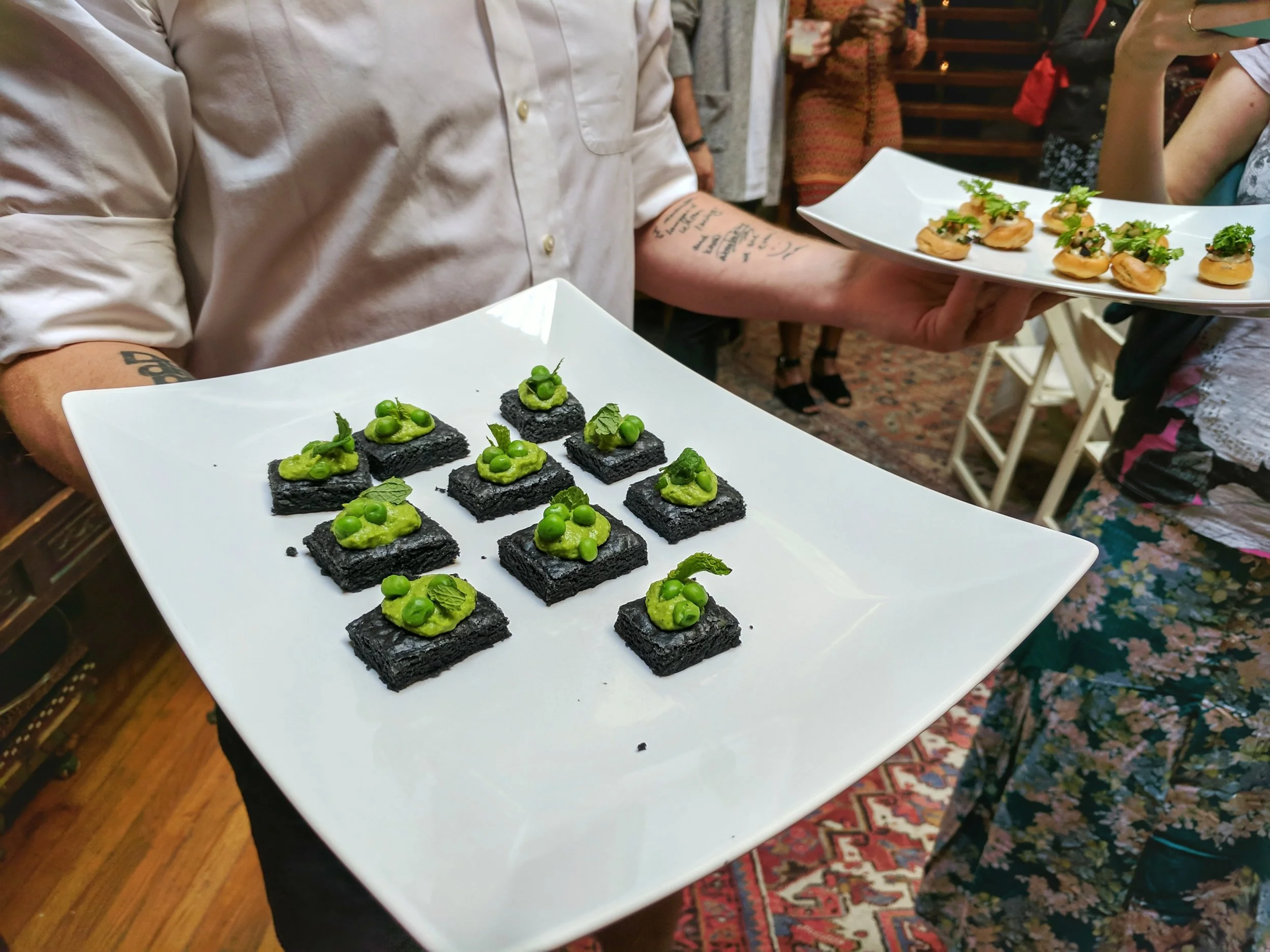 The appetizers: Brown Butter Shortbread with Summer Peas (front) and Sherried Foie Gras Gougéres (back)