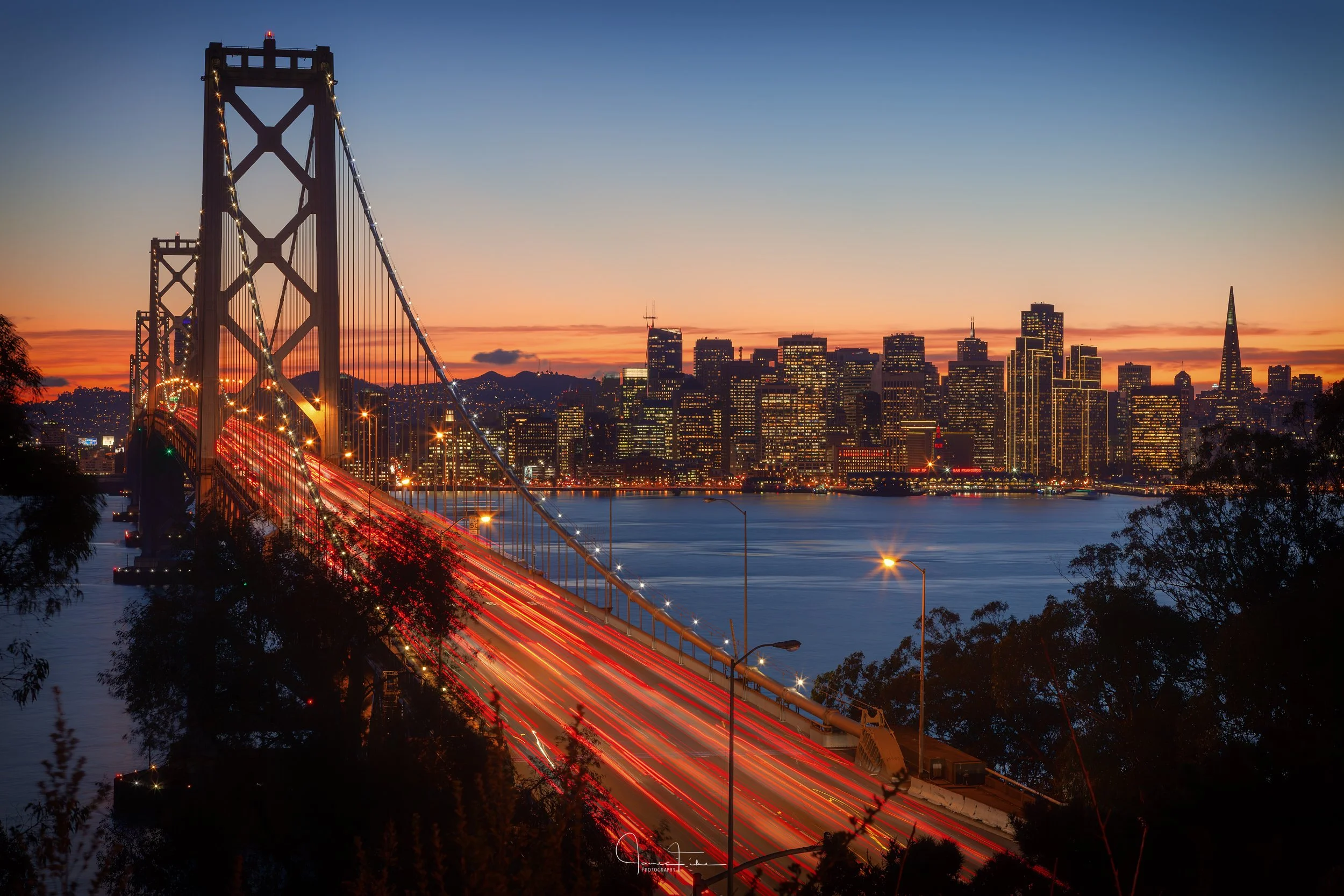 bay-bridge-san-francisco-skyline-light-trails-blue-hour.jpg