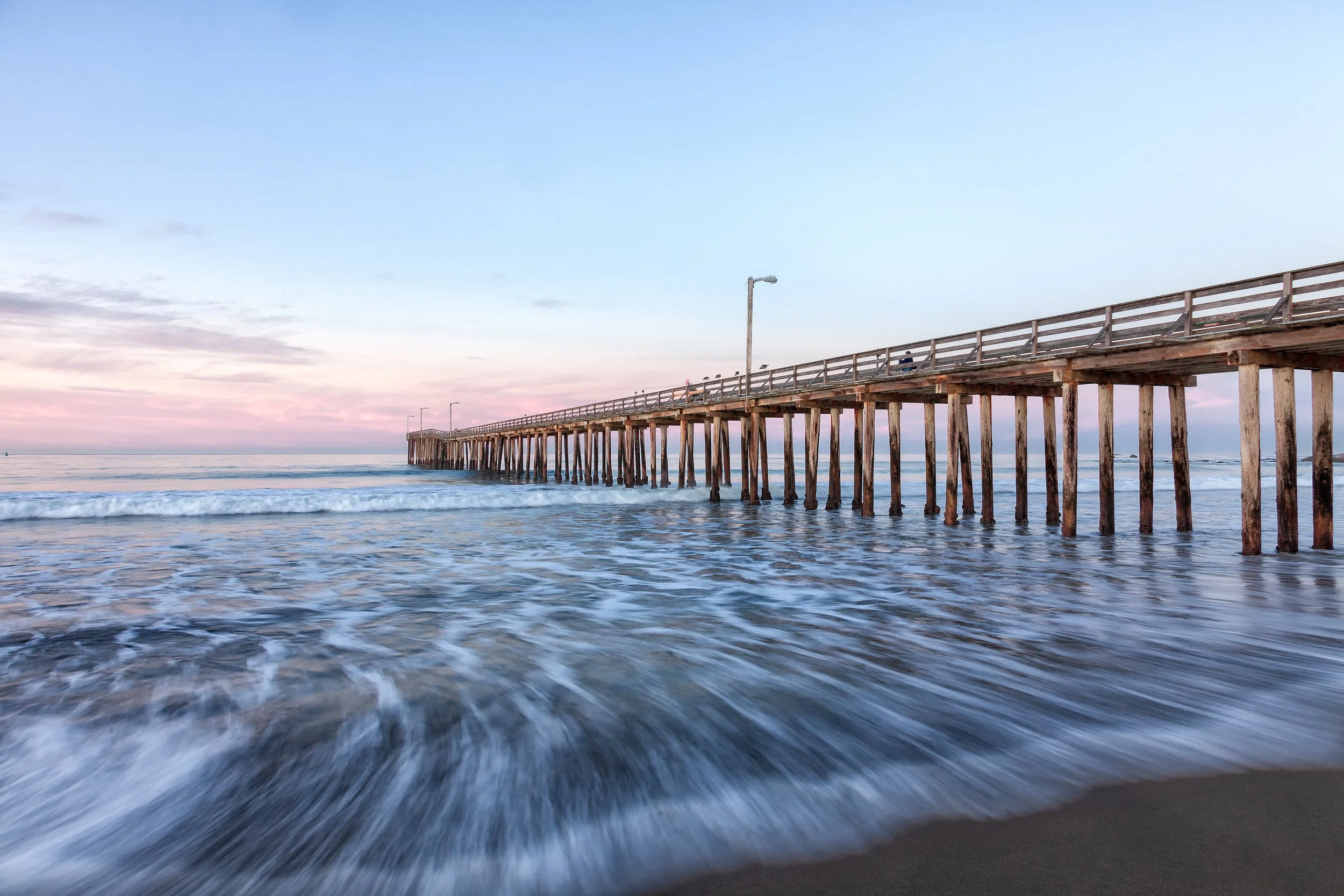Into the Tide

 

 Cayucos Pier stands along the shoreline in Cayucos on California’s central coast. The wooden pier has been a familiar feature of the town’s waterfront for generations and remains a local landmark. 