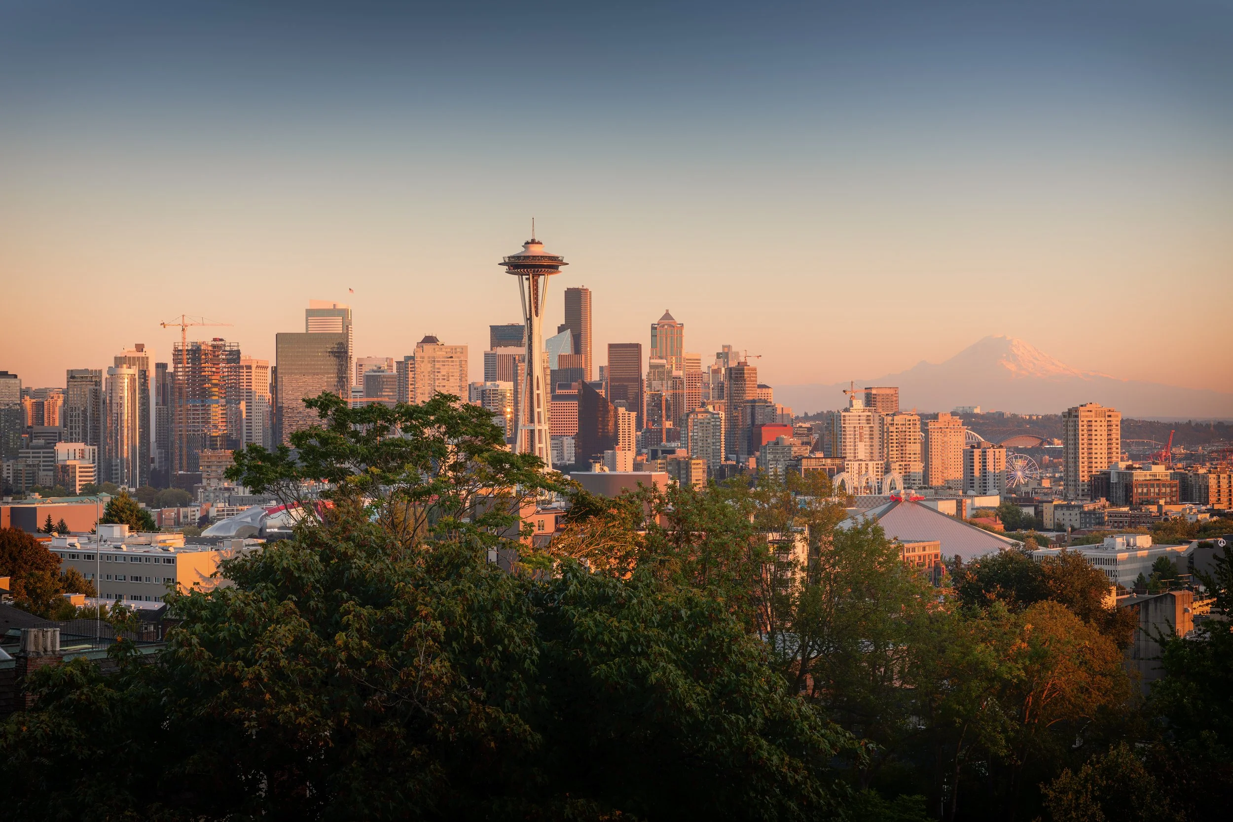 Seattle Evening with Mount Rainier

 

 Seattle’s skyline is seen from Kerry Park in the Queen Anne neighborhood, with the Space Needle and Mount Rainier both visible from the overlook. Kerry Park is one of the city’s best-known public viewpoints. 