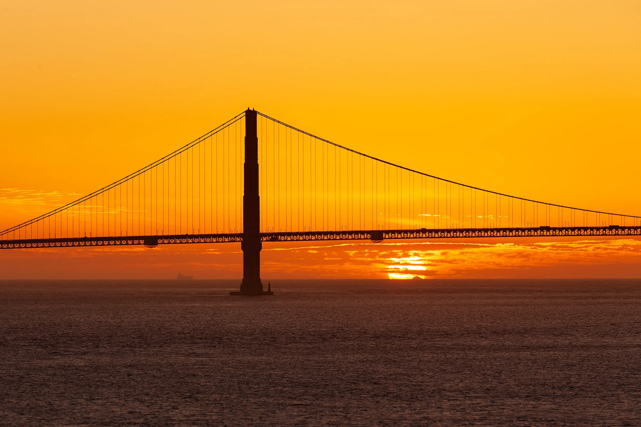 Golden Gate Sunset from Alcatraz

 

 The Golden Gate Bridge crosses the entrance to San Francisco Bay at sunset, seen from Alcatraz Island with the bridge silhouetted against the orange sky. 