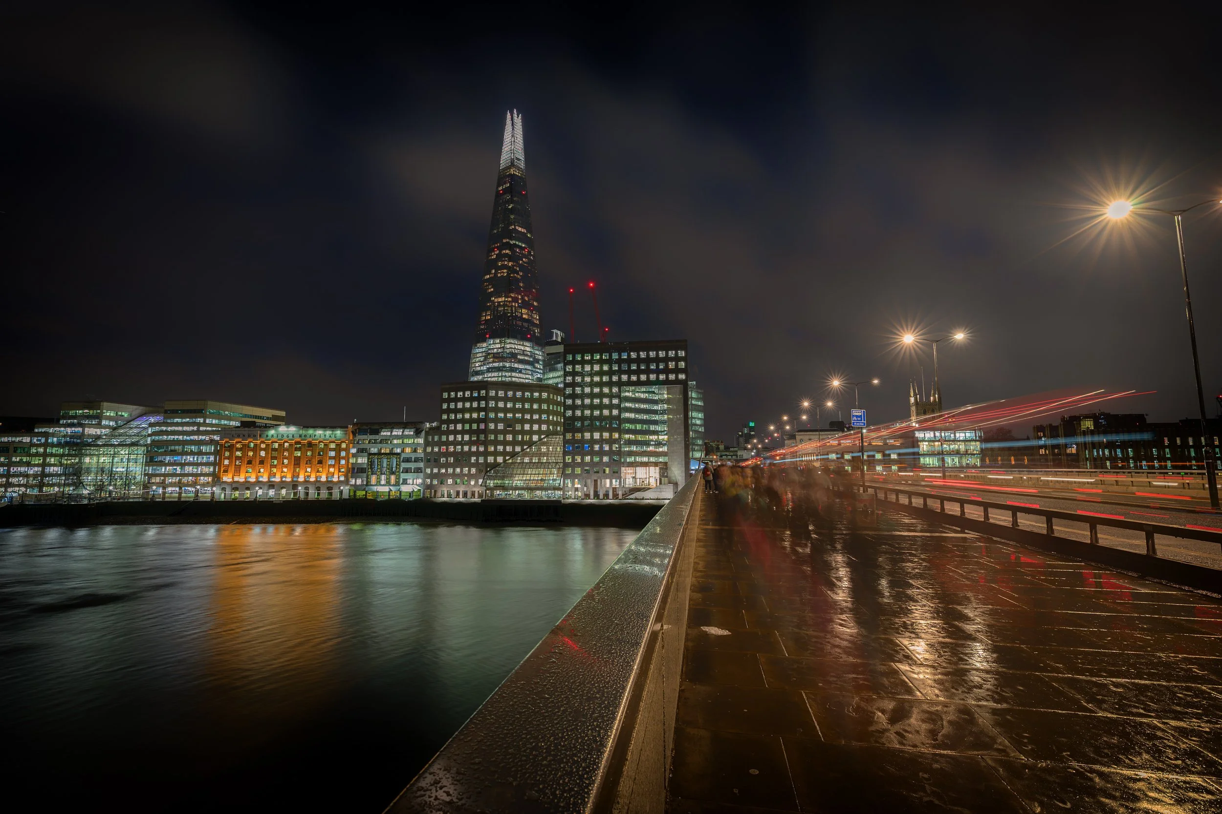 The Shard from London Bridge

 

 The Shard rises above Southwark near London Bridge on a rainy night. The area around London Bridge includes major transit connections, riverside streets, and contemporary architecture along the River Thames. 