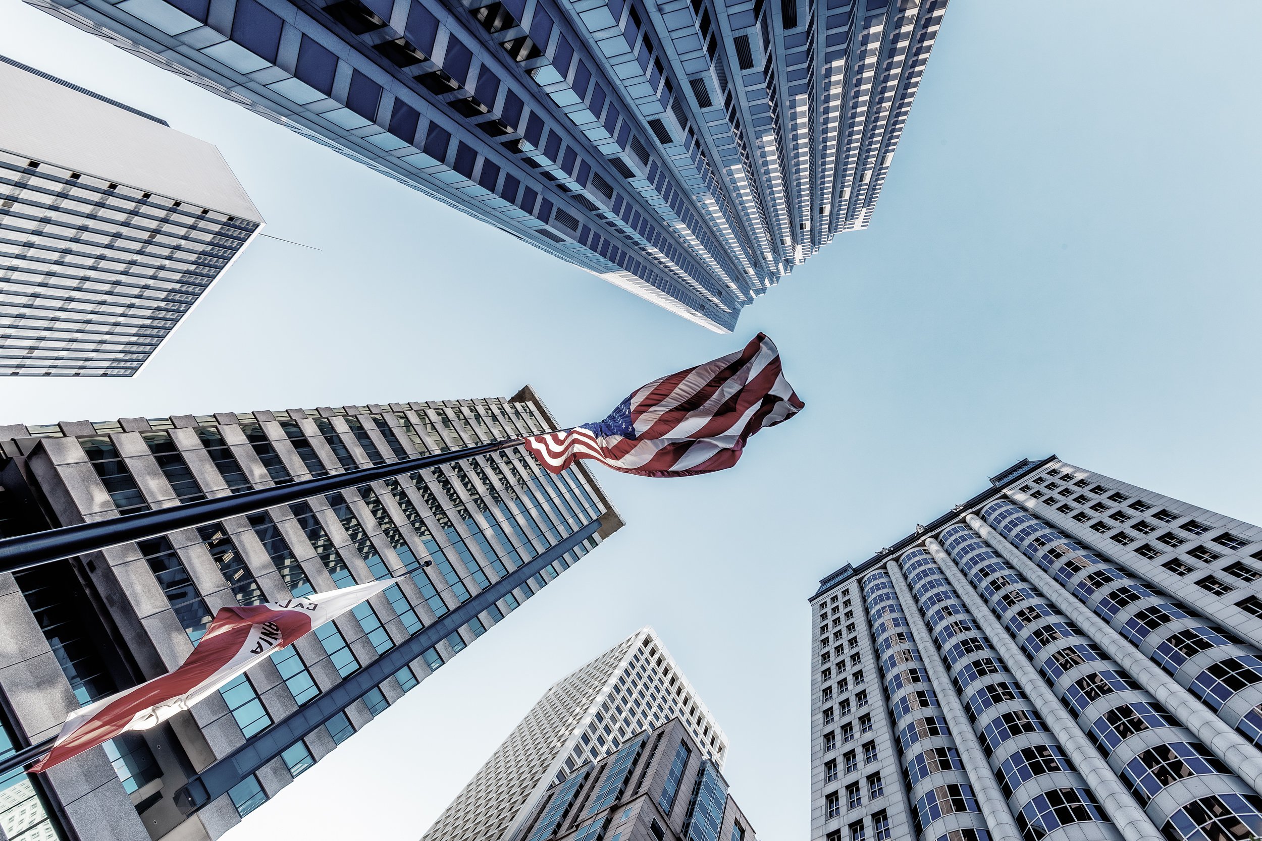 Standing Tall

 

 High-rise office buildings and an American flag appear in San Francisco’s Financial District. The area contains many of the city’s major commercial towers, office buildings, and downtown streets. 