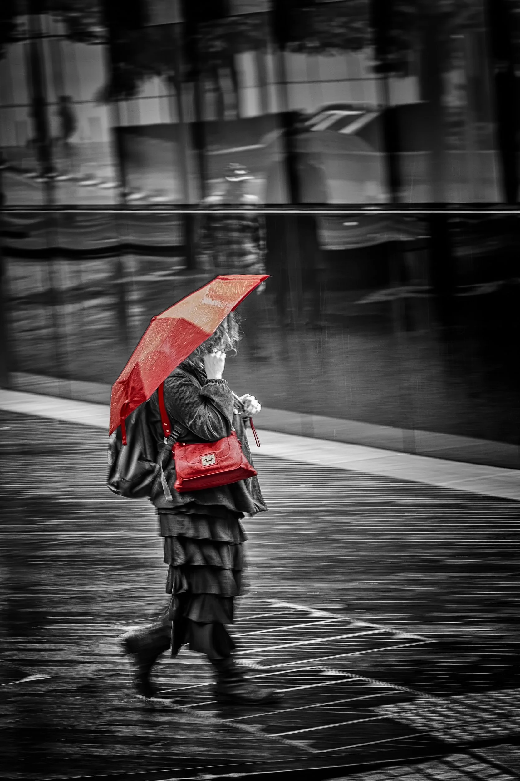 Walking in the Rain

 

 A rainy London street scene with a pedestrian moving past wet pavement, reflective glass, and the riverfront streets near Tower Bridge. The moment belongs to the ordinary movement of the city as much as to its landmarks. 
