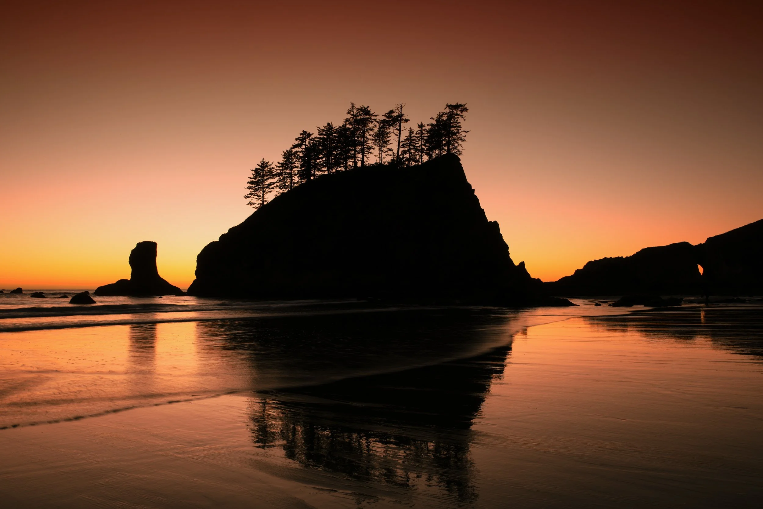 Last Light on Second Beach

 

 Second Beach lies along the Pacific coast within Olympic National Park in Washington. Sea stacks, tide-washed shoreline, and broad sunset horizons define this section of the park’s coastline. 