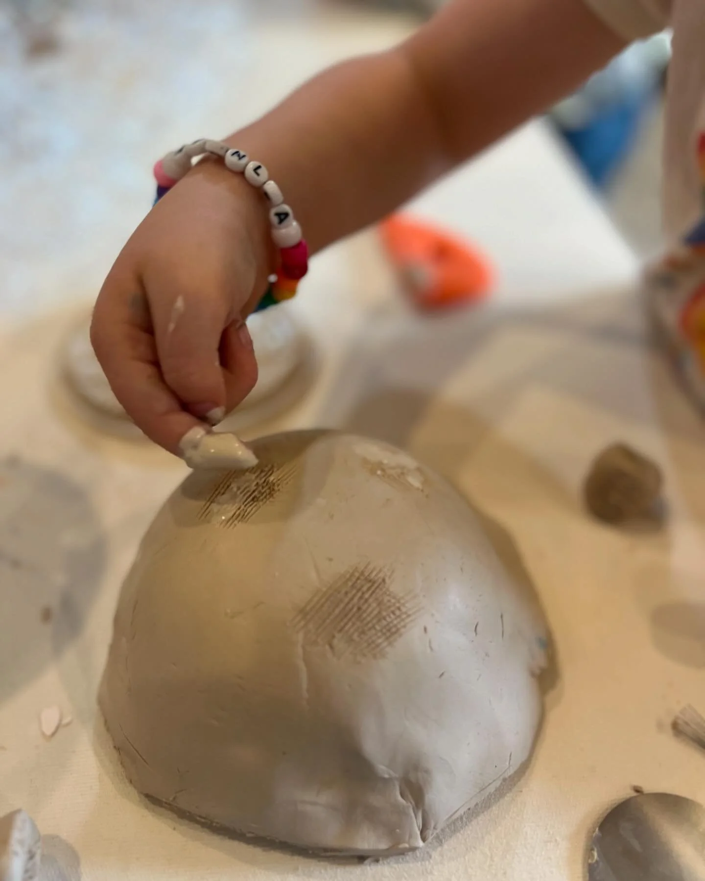 Learning to score and slip making tripod bowls. It&rsquo;s so fun to share my love of Clay with the kiddos, they were drawn to the process and their pieces came out beautiful.  #kidsmakeart  #playwithclay #ceramicwithkids #kidsceramicart #finemotorsk