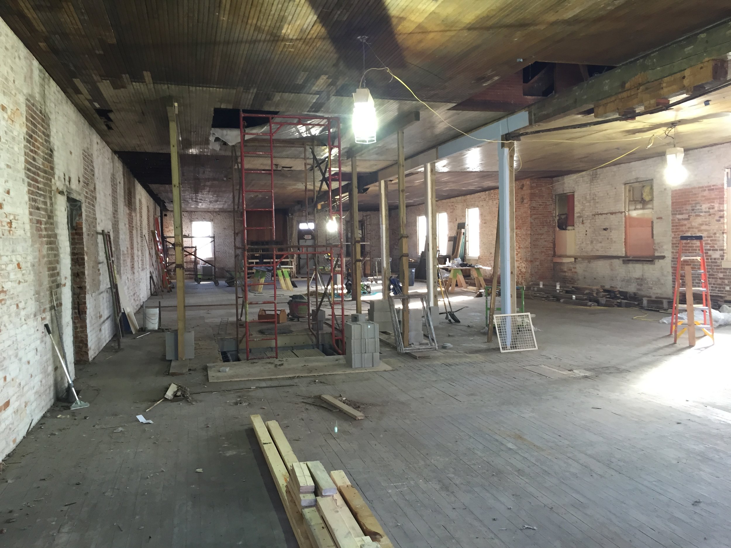 Crew cleaning the lay lights and ceiling on the second floor of the Conley-Maass Building.