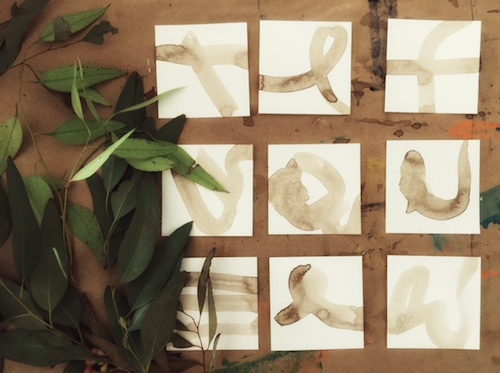 Squares with walnut ink, ready for printing with eucalyptus leaves.