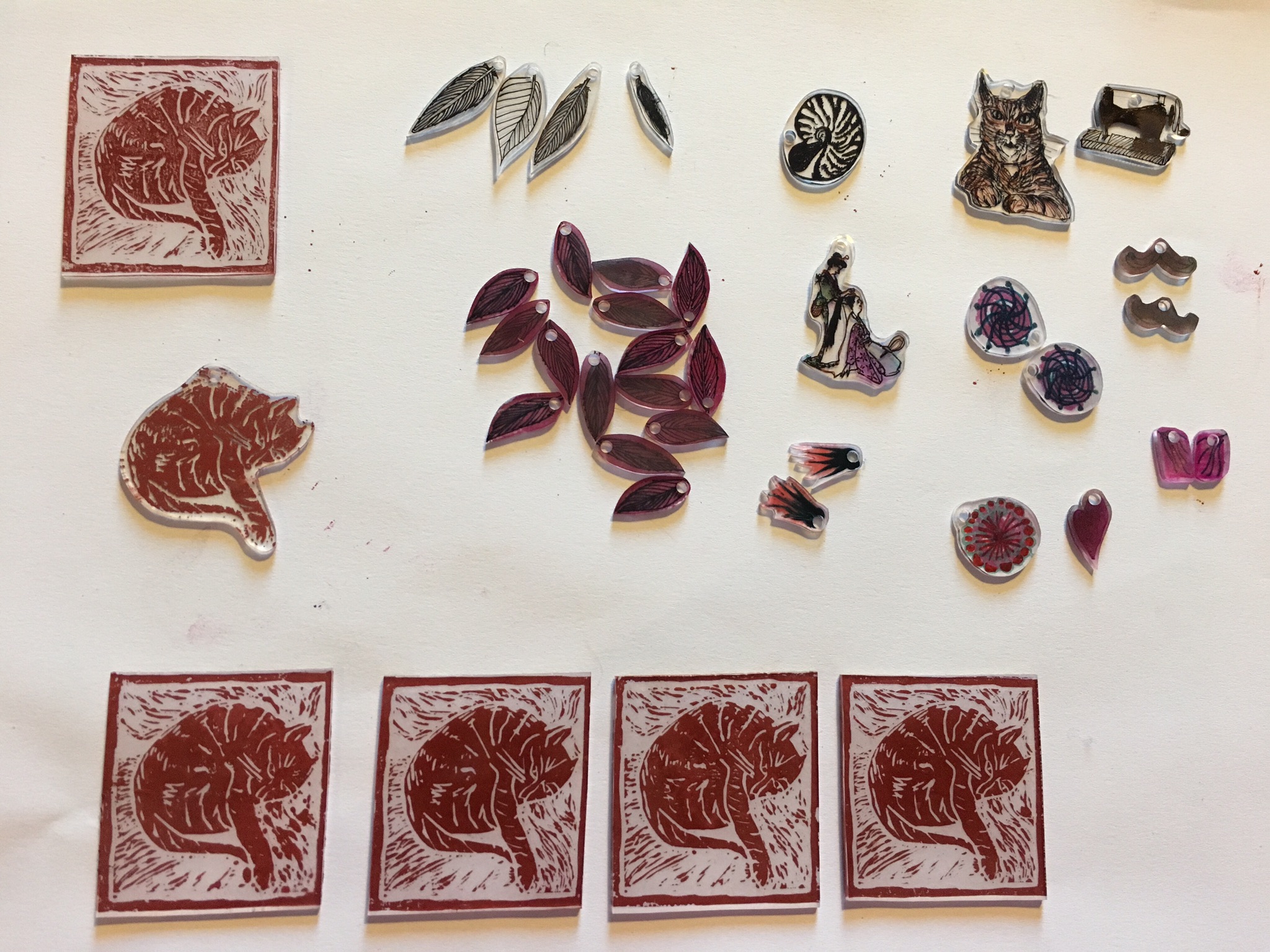 Experiments in shrinkable plastic - with drawing and lino printing