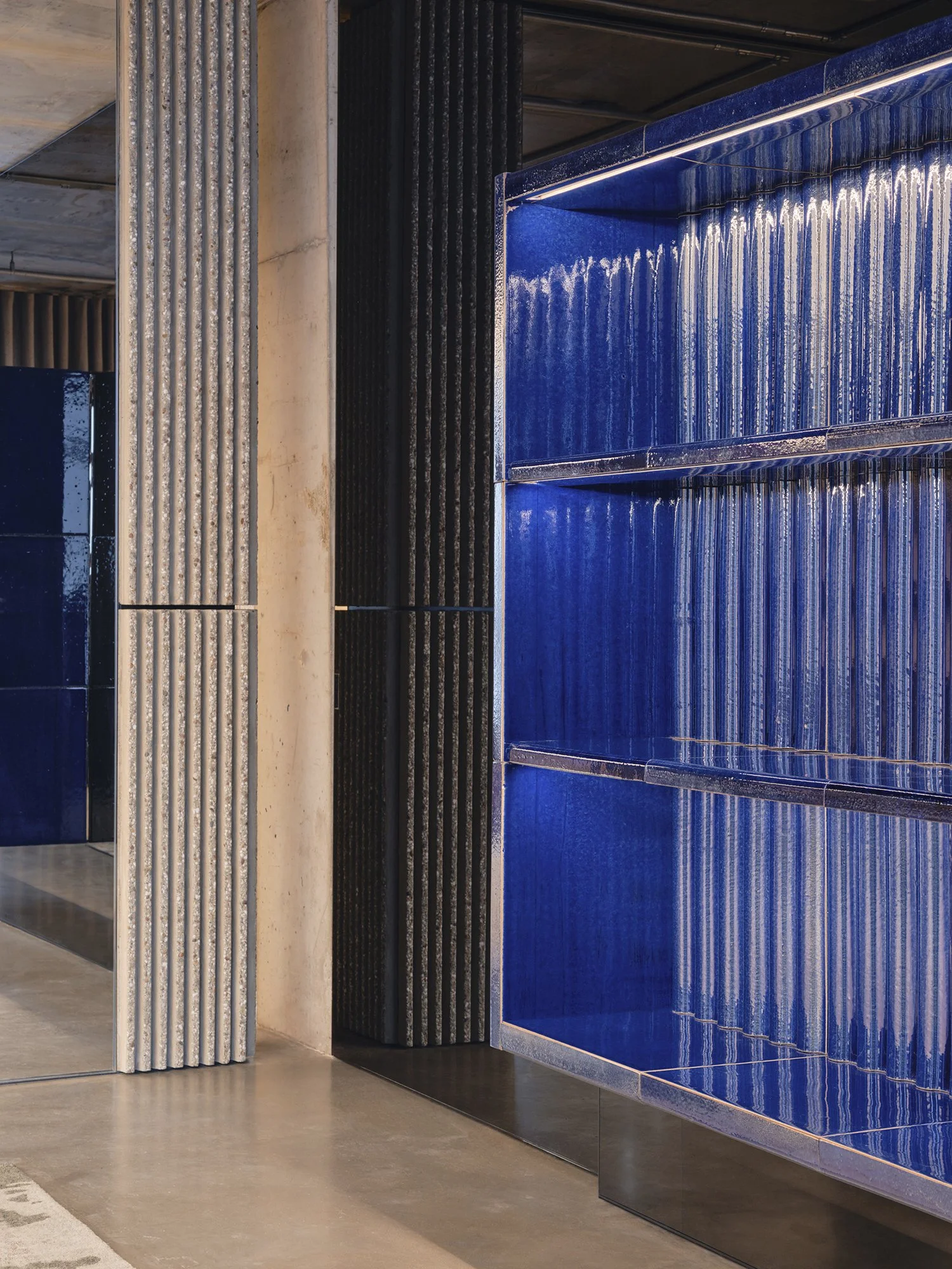 Commercial interior photography of Saint Laurent lit shelving feature