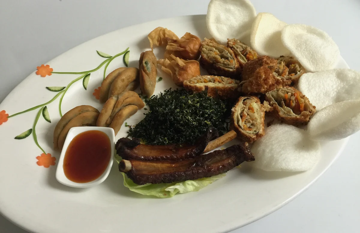 Dragon Dim Sum Platter - BBQ Spare Ribs, Spring Onion Pancakes, Crispy Won Ton, Duckling Spring Rolls, Crispy Seaweed, Prawn Crackers, Sweet & Sour Sauce.