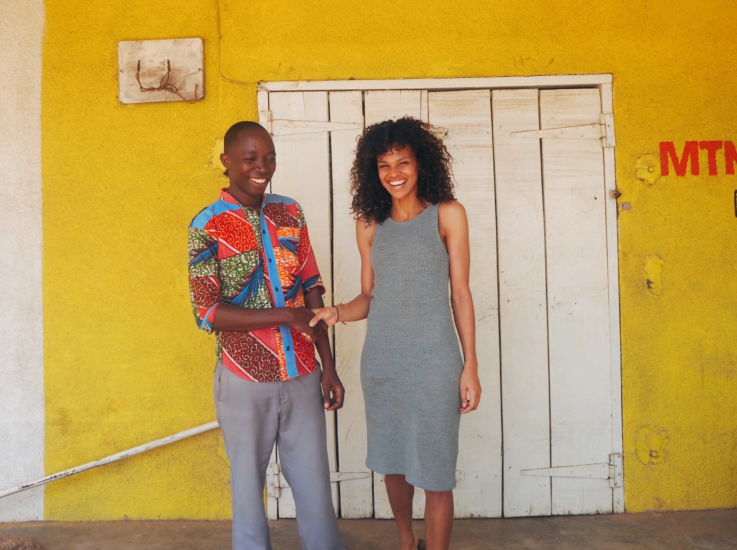 behind the Kind - happy handshakes.JPG