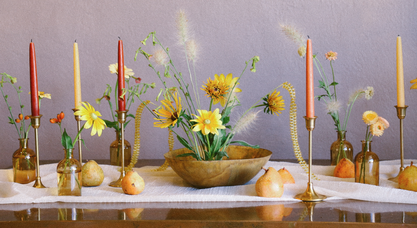 Simple amber bud bottles, taper candles, gold tarnished bowls (all in the shop now) designed to create a simple harvest moon tabletop.