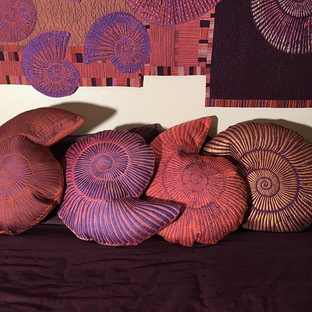 Silk ammonite pillows are delicious!#artpillows #ammonites#quilted #fiberarts #silkpillows #silk #decorativepillows #bedart #sofaart