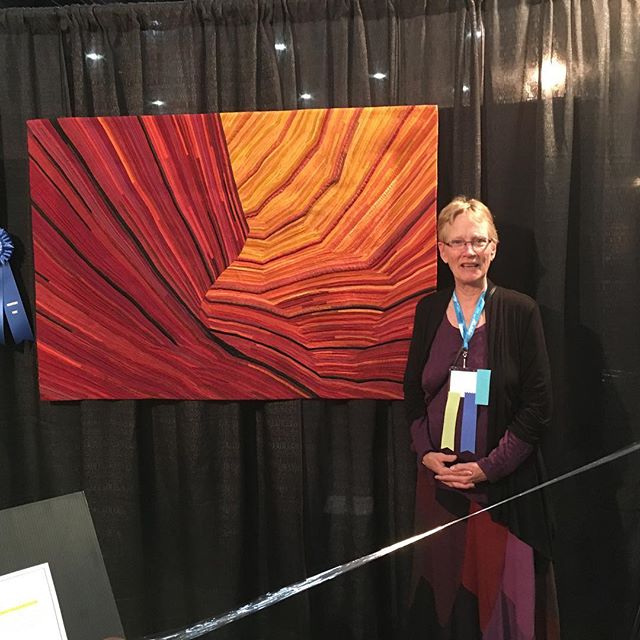Fire in the Stone just won blue ribbon in Houston IQA show. Wow! So honored! #artquilts #coyotebuttes #silkquilts #sandstone