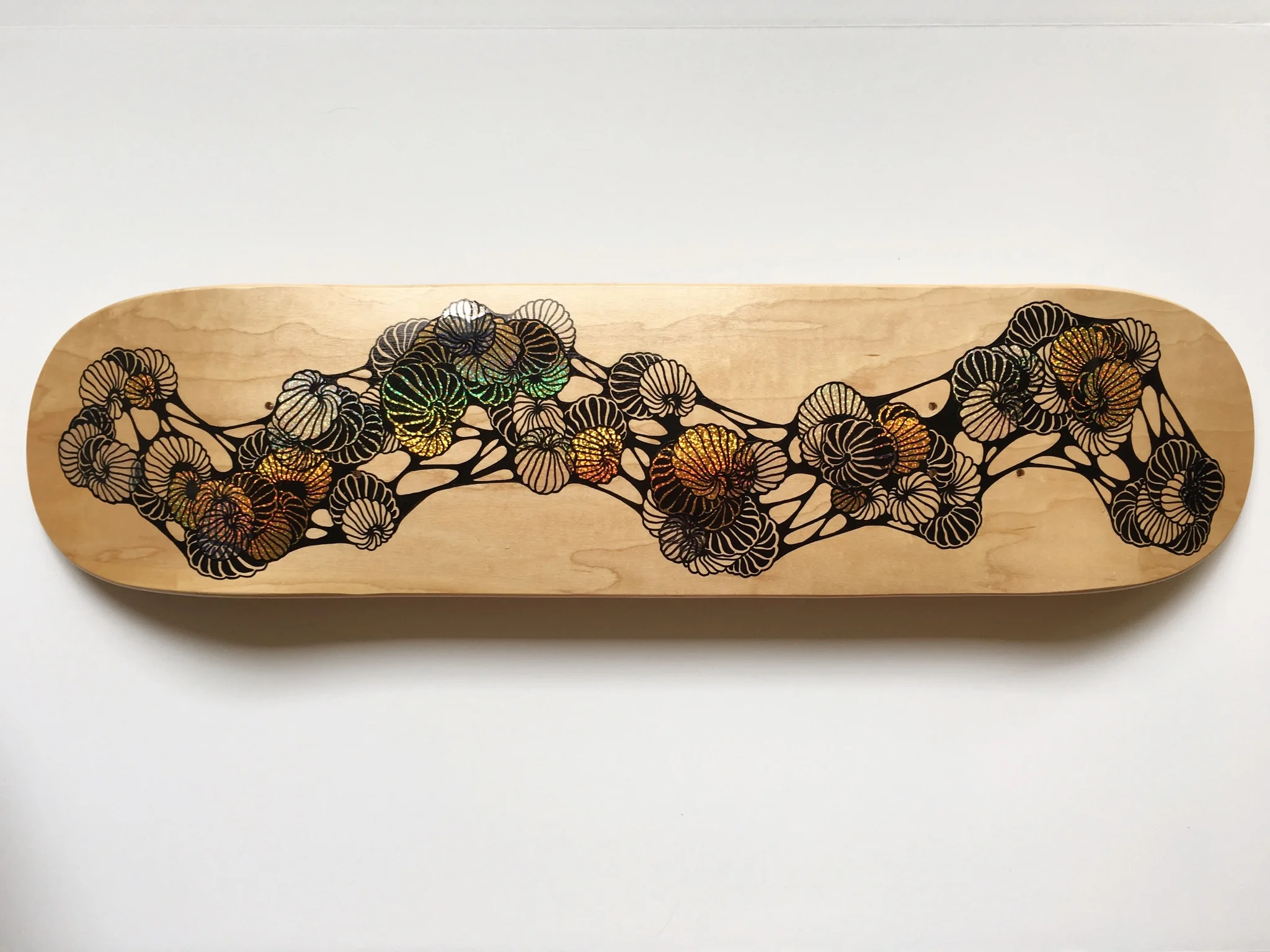  Ink and holographic stickers on blank skateboard deck, 2016 