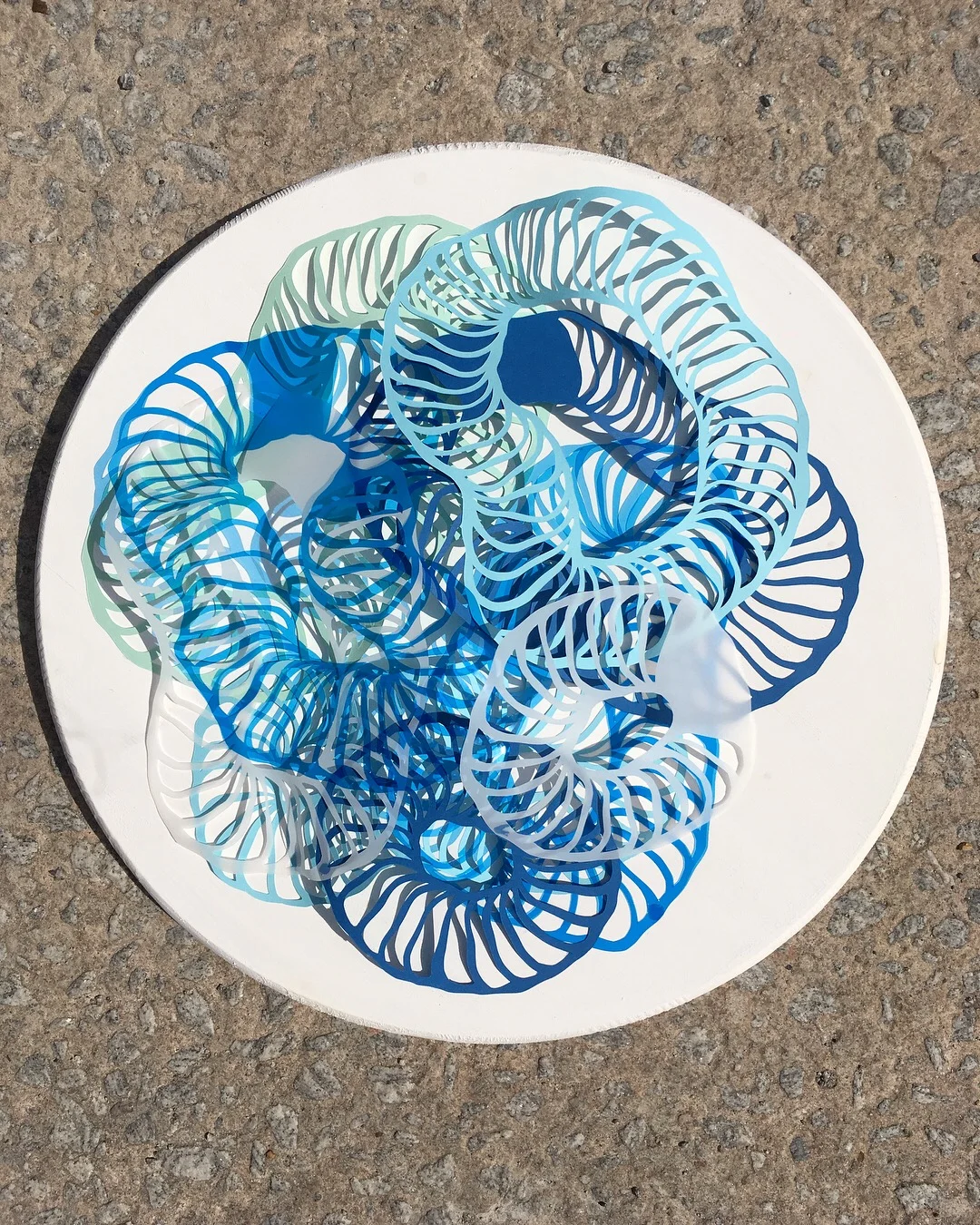   Petri Dish No.2,  2018  Cut paper and mylar on wood panel 
