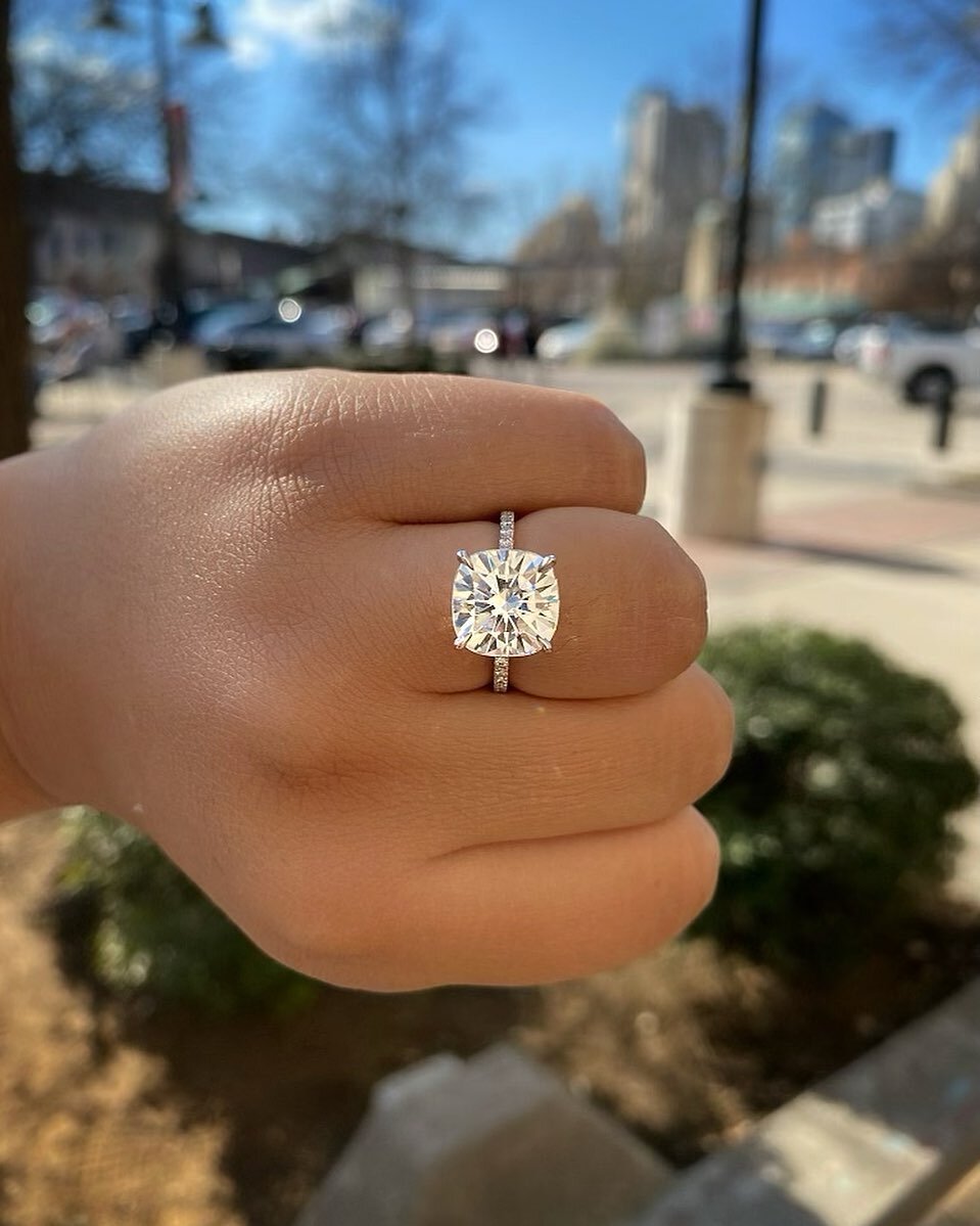 #TheTaylorRing with a 10mm Brilliant Cushion #TrueGemMoissanite (approximately 5.00ct diamond equivalent) in #recycled 18K White Gold 💍 Modeled by @alishak_ on a size 5.75-6 hand ✨