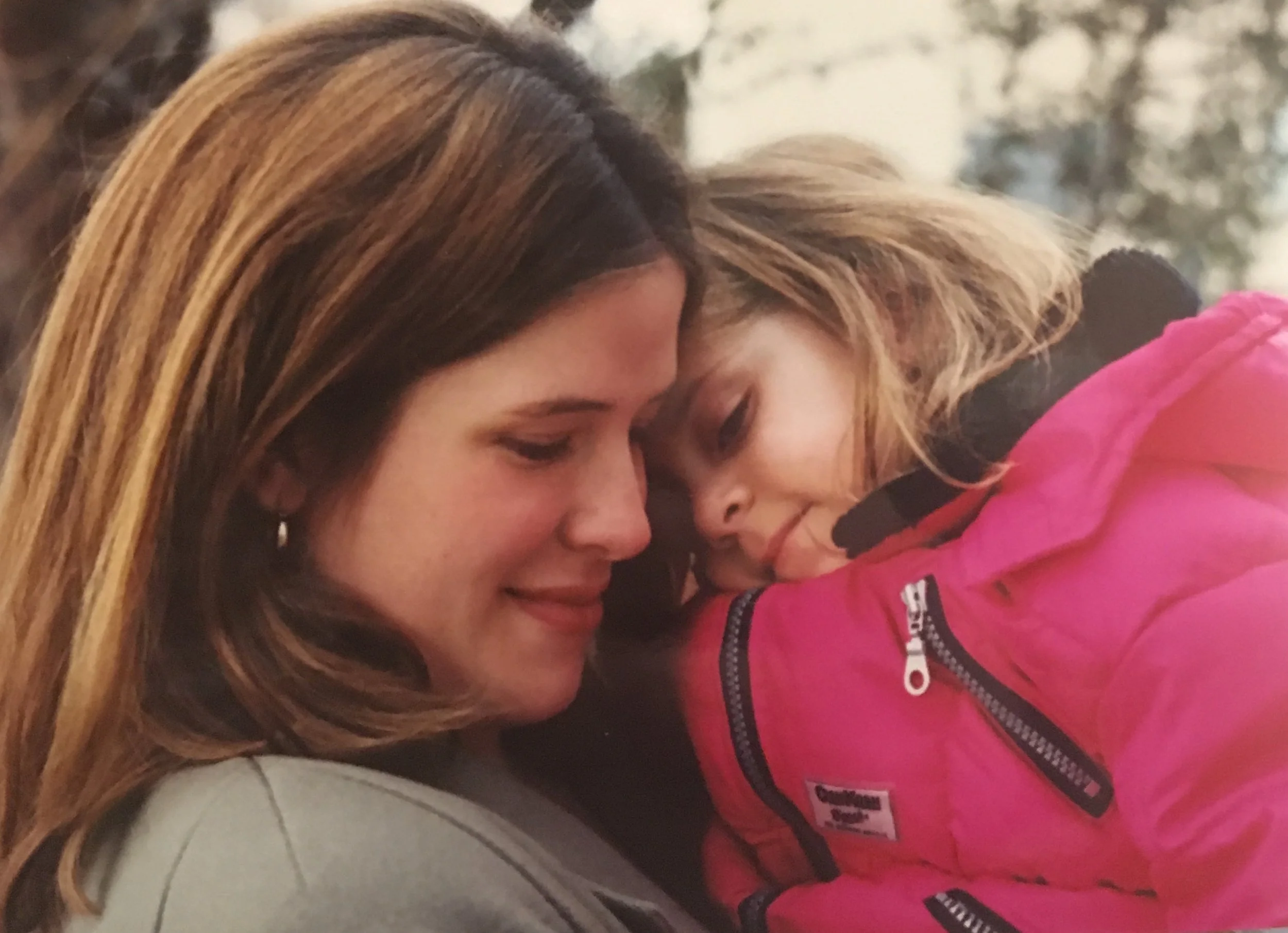 Cuddling with my two-year-old daughter.