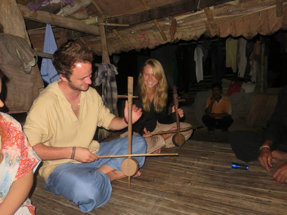 Playing music with a local tribe on a trek in Thailand