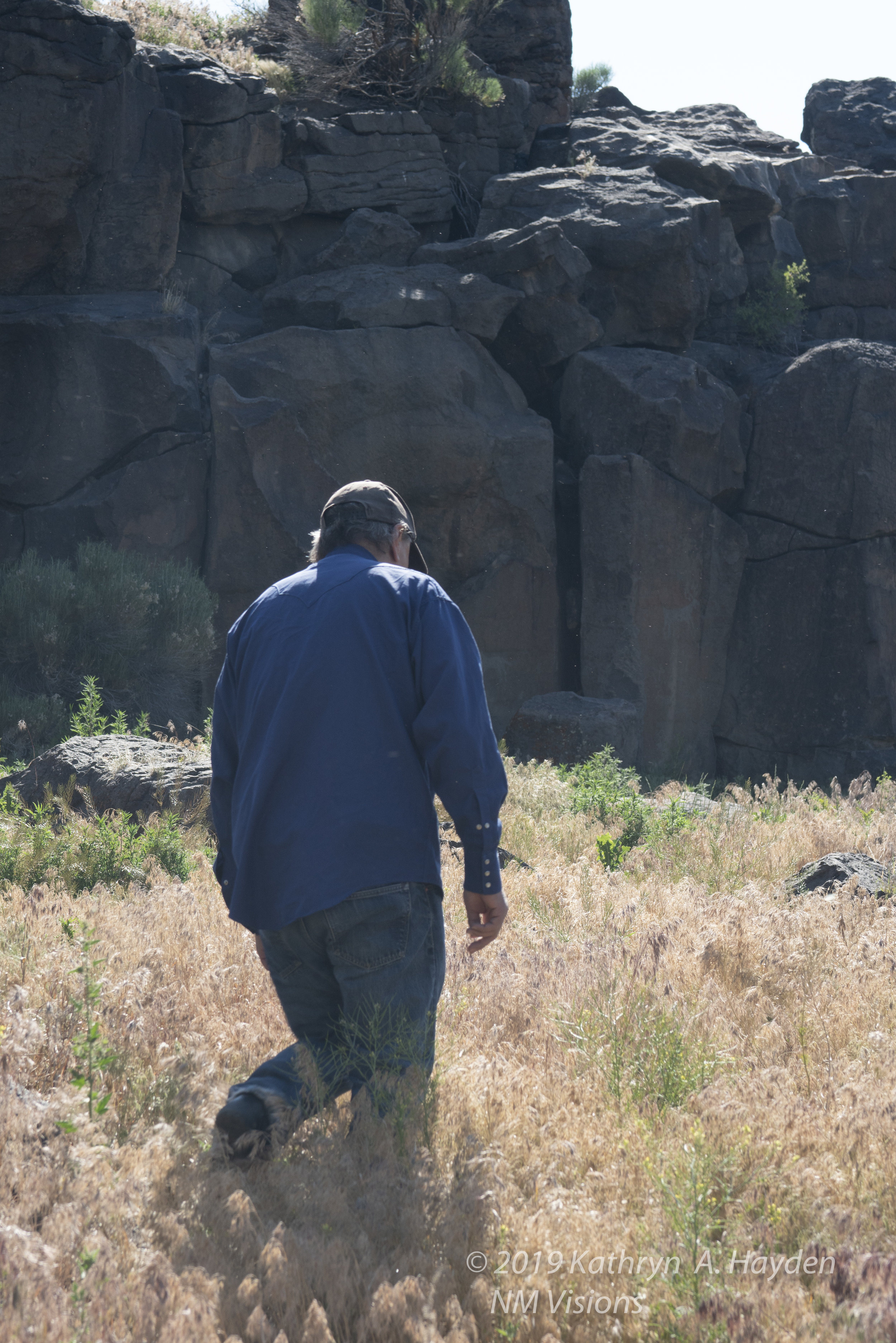  Robert leads group to series of petroglyphs along the rock face. 