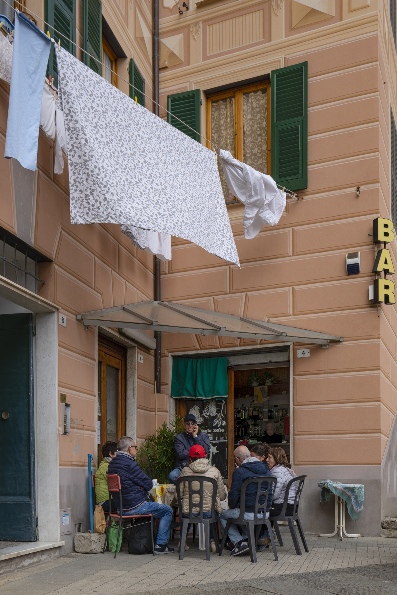 Drinking under washing, Camogli, Liguria