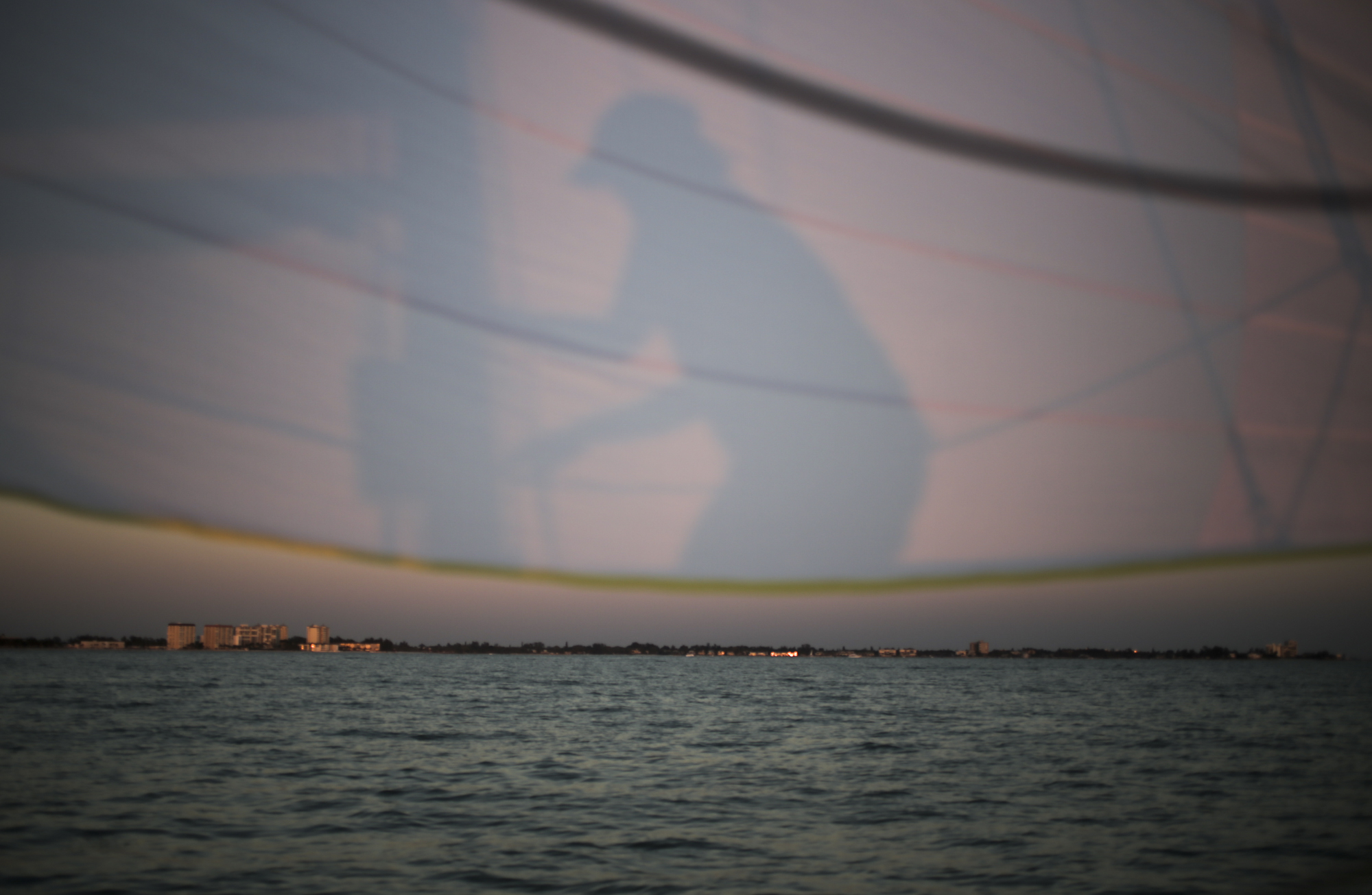 Dawn Narramore of Tampa adjusts the mast of the Mad Cow 2 as the sun sets over Long Boat Key, north of Sarasota, Friday, May 26, 2017. Narramore is originally from Wichita, Kansas and did not sail before she moved to Tampa about 20 years ago. She is now part of a seven person crew that sailed a 24-hour, 100-mile competition from Egmont Key to Fort Meyers.