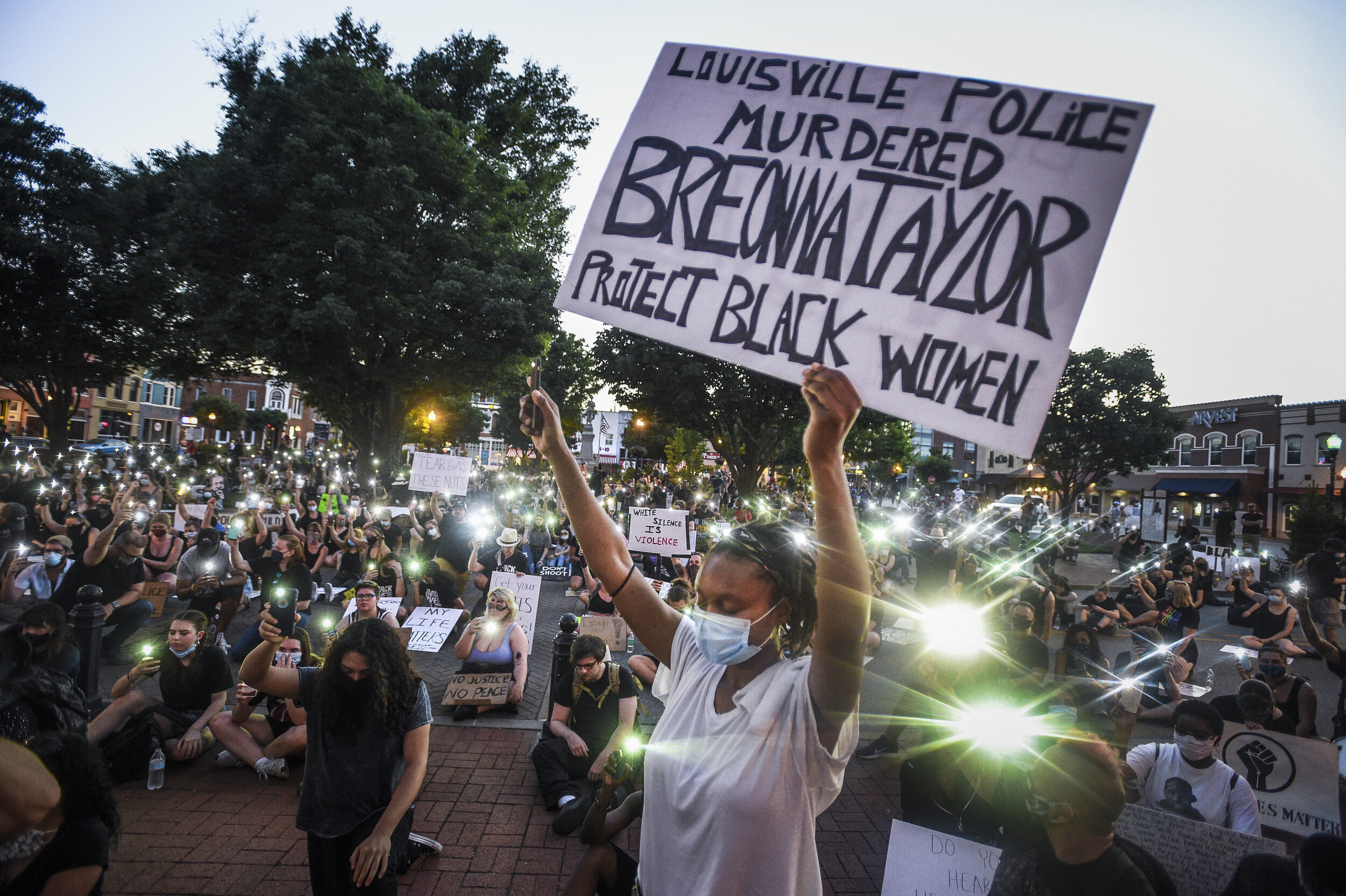  Protestors kneel during a protest rally against police violence at the Bentonville Square a week after Benton County Sheriffs deployed tear gas. They knelt for eight minutes and 46 seconds, the duration of the time that Derek Chauvin knelt on George