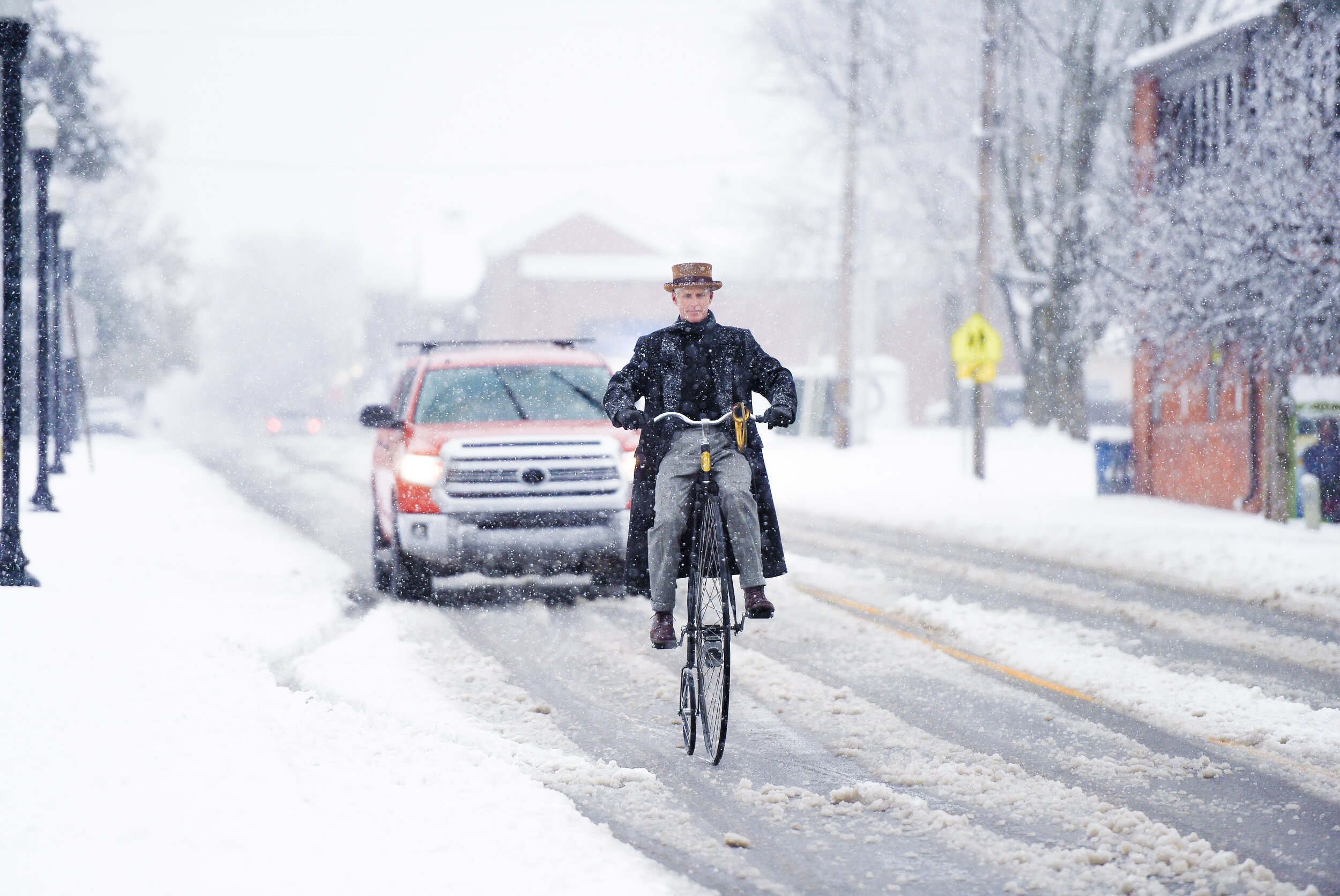  Chuck Cates of Bentonville rides his penny-farthing bike along 2nd St in downtown Bentonville, Sunday, December 13, 2020 