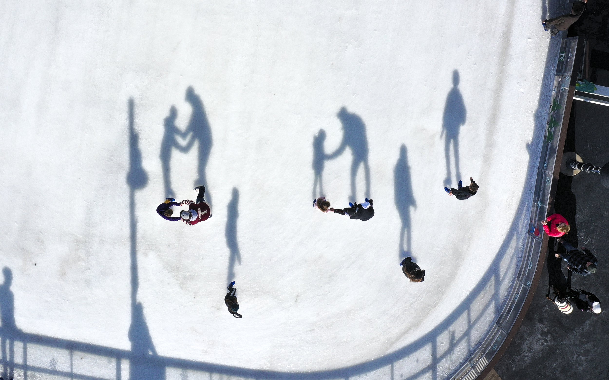  Attendees ice skate at the Lawrence Plaza ice rink in Bentonville, Ark., Sunday, February 6, 2022  