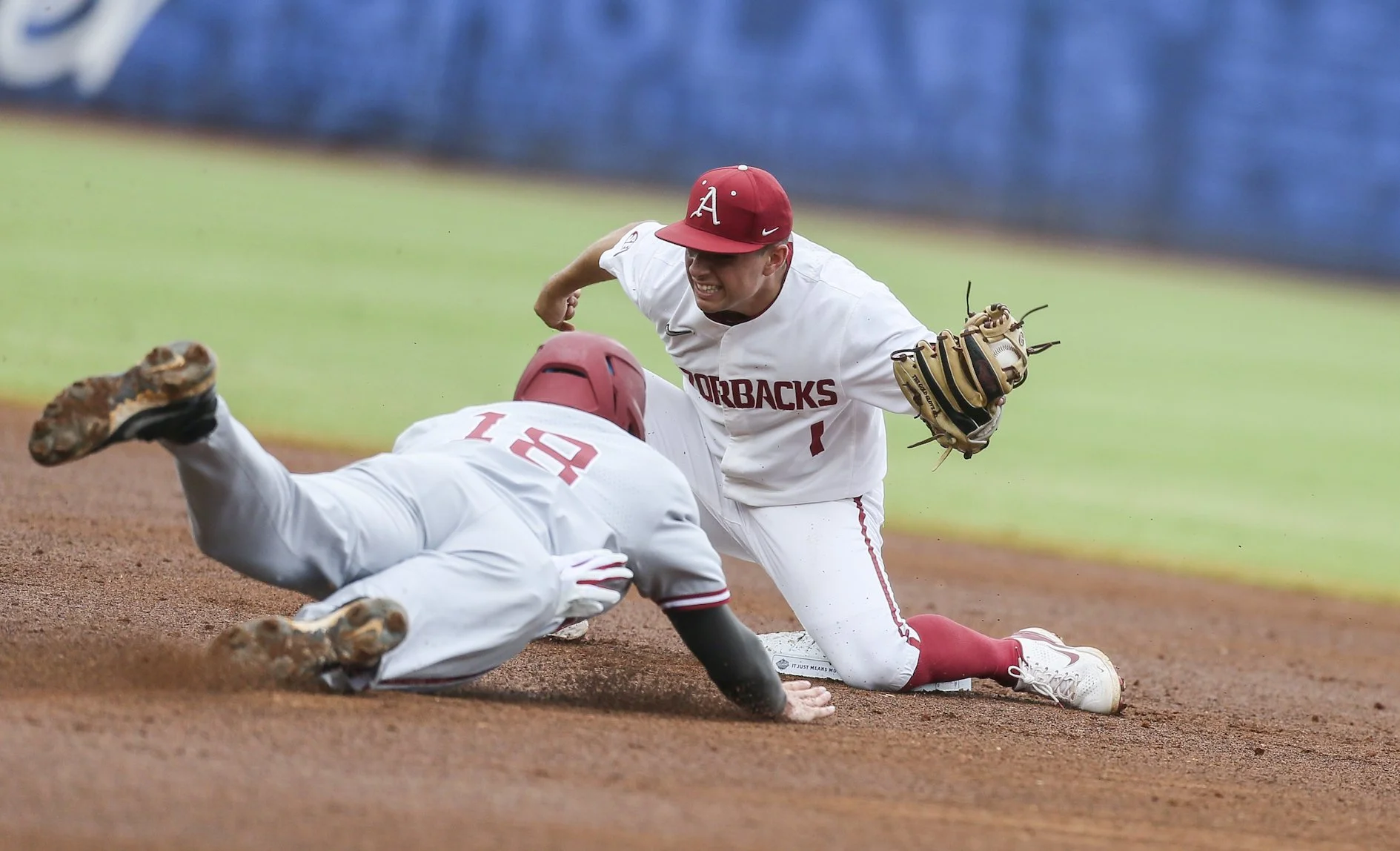 Arkansas infielder Robert Moore (1) attempts to force out Alabama infielder Drew Williamson (18) sliding into second, Wednesday, May 24, 2022 during the second inning of the SEC Baseball Tournament at the Hoover Metropolitan Stadium in Hoover, Ala.