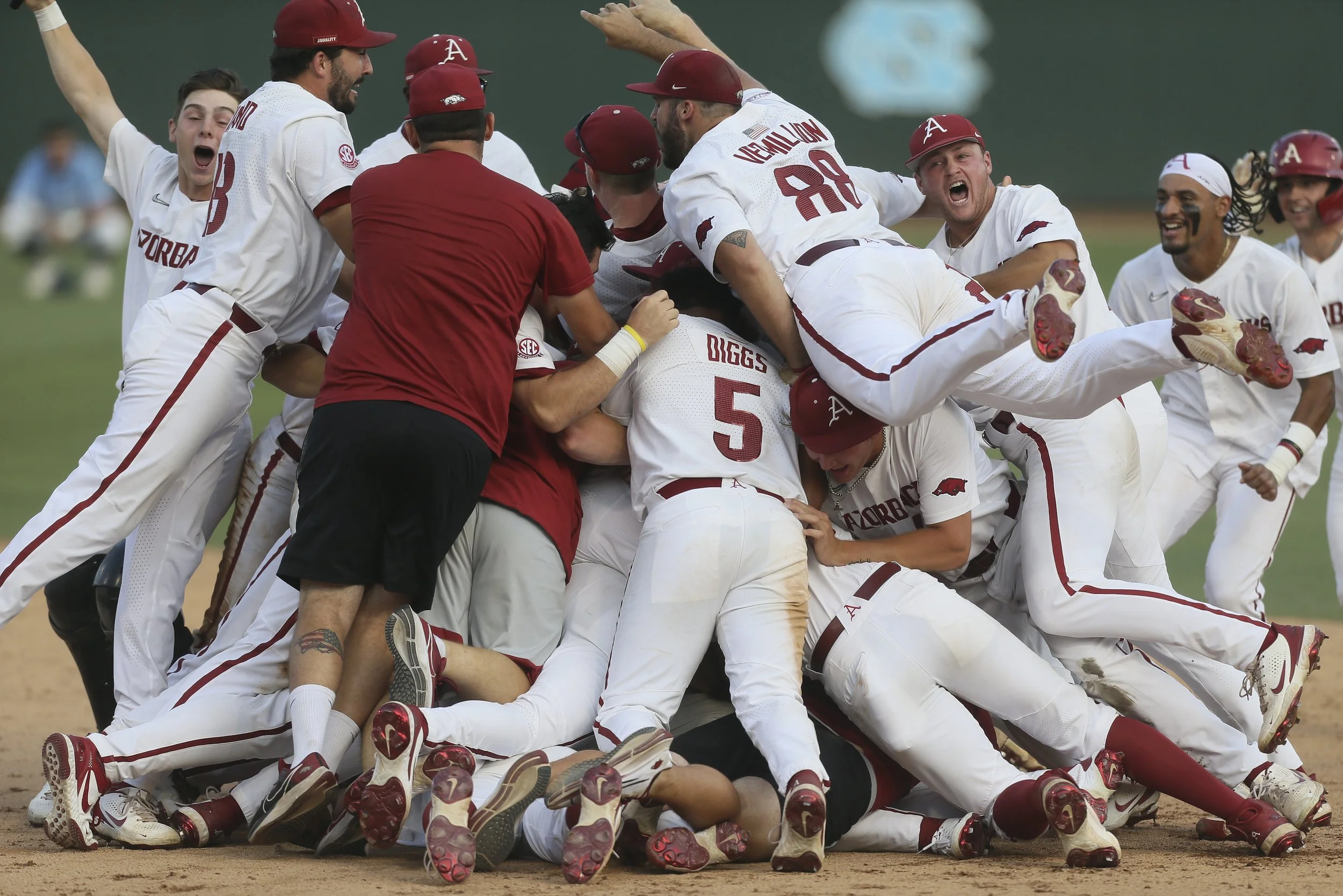 Arkansas players celebrate, Sunday, June 12, 2022 at the end of the 9th inning during the NCAA Baseball Super Regional game 2 at Boshamer Stadium in Chapel Hill, NC.