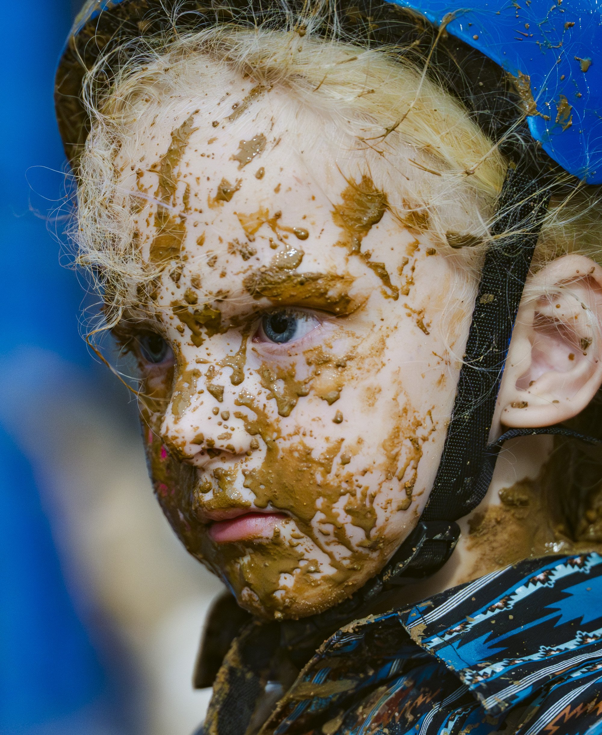 A muddy child looks on after completing her ride in the mutton bustin' event, Thursday, June 25, 2026 during the second night of the Rodeo of the Ozarks at Parsons Stadium in Springdale. The Rodeo of the Ozarks, now in its 82nd year, features heart p