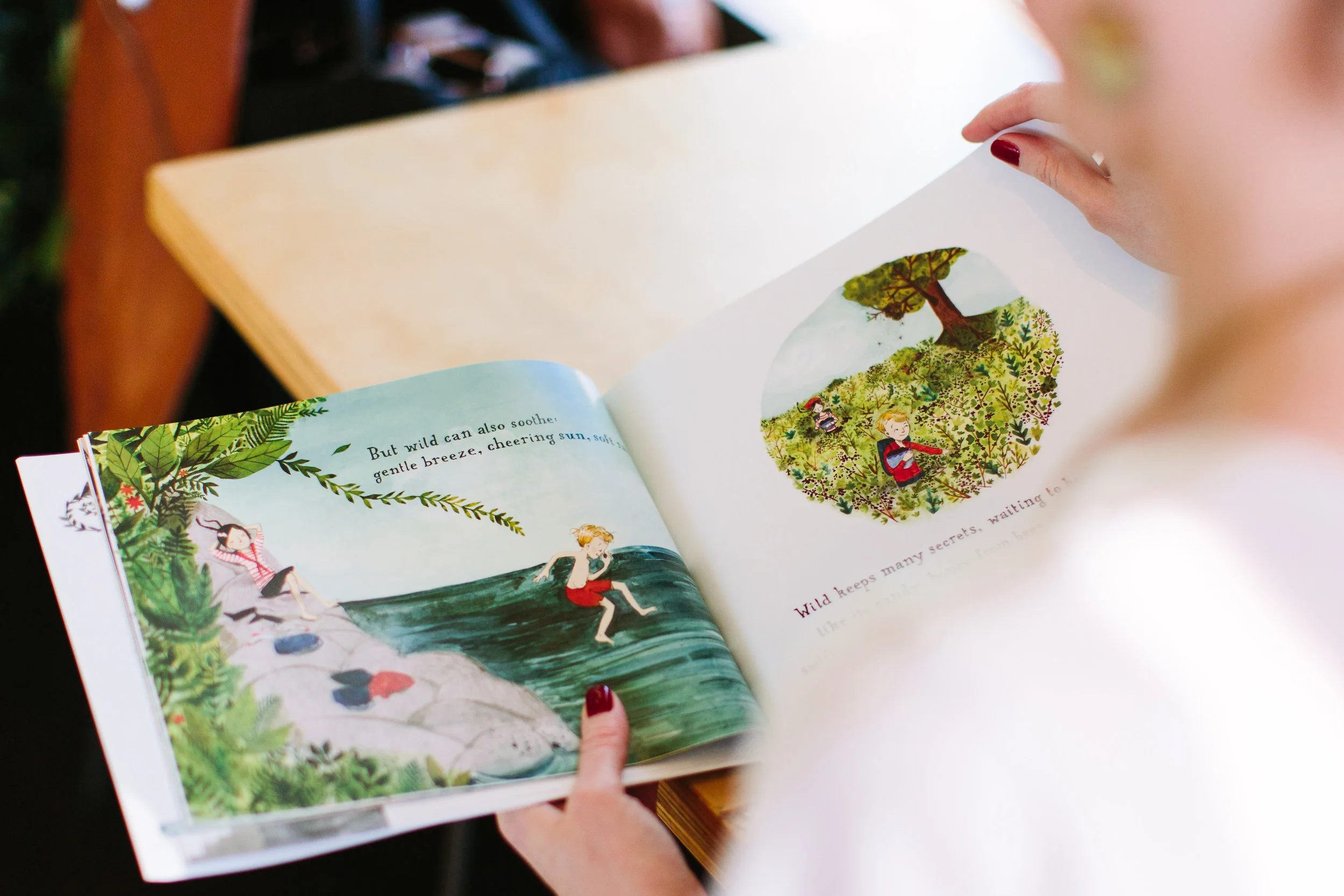 The storybook in this image is Finding Wild , with illustrations by Abigail Halpin.