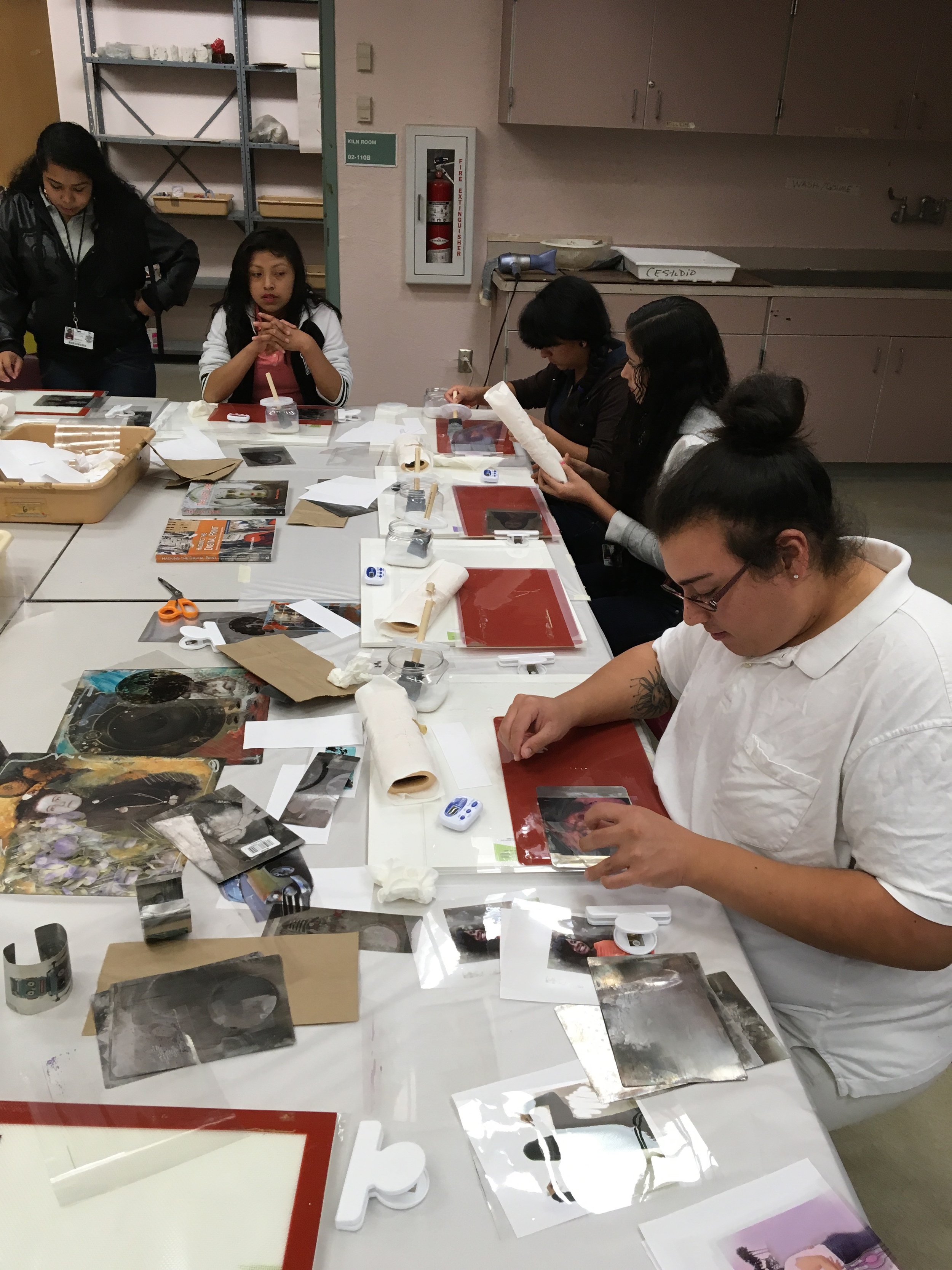 Students making their photo selfies on metal.