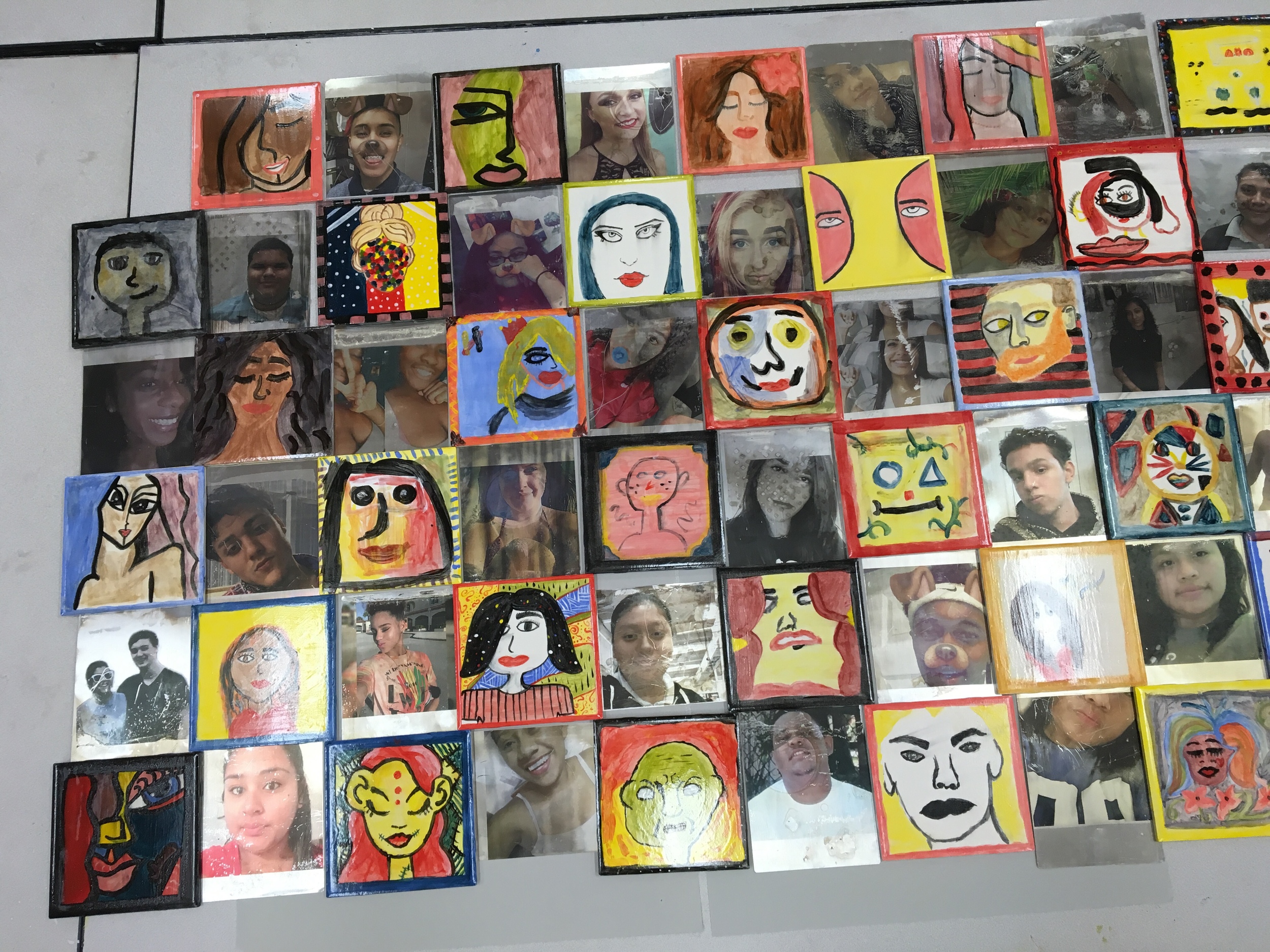Some of the 220 metal selphies in our mural project.