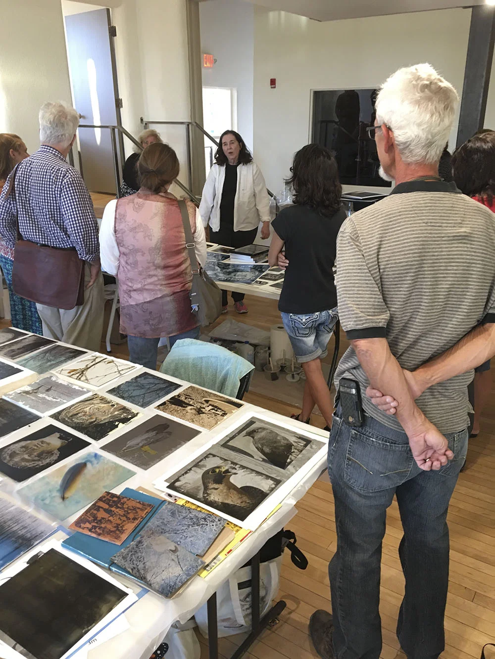 Bonny at the evening "Double Exposure" lecture. Some great artist work is in the foreground. BRAVO!