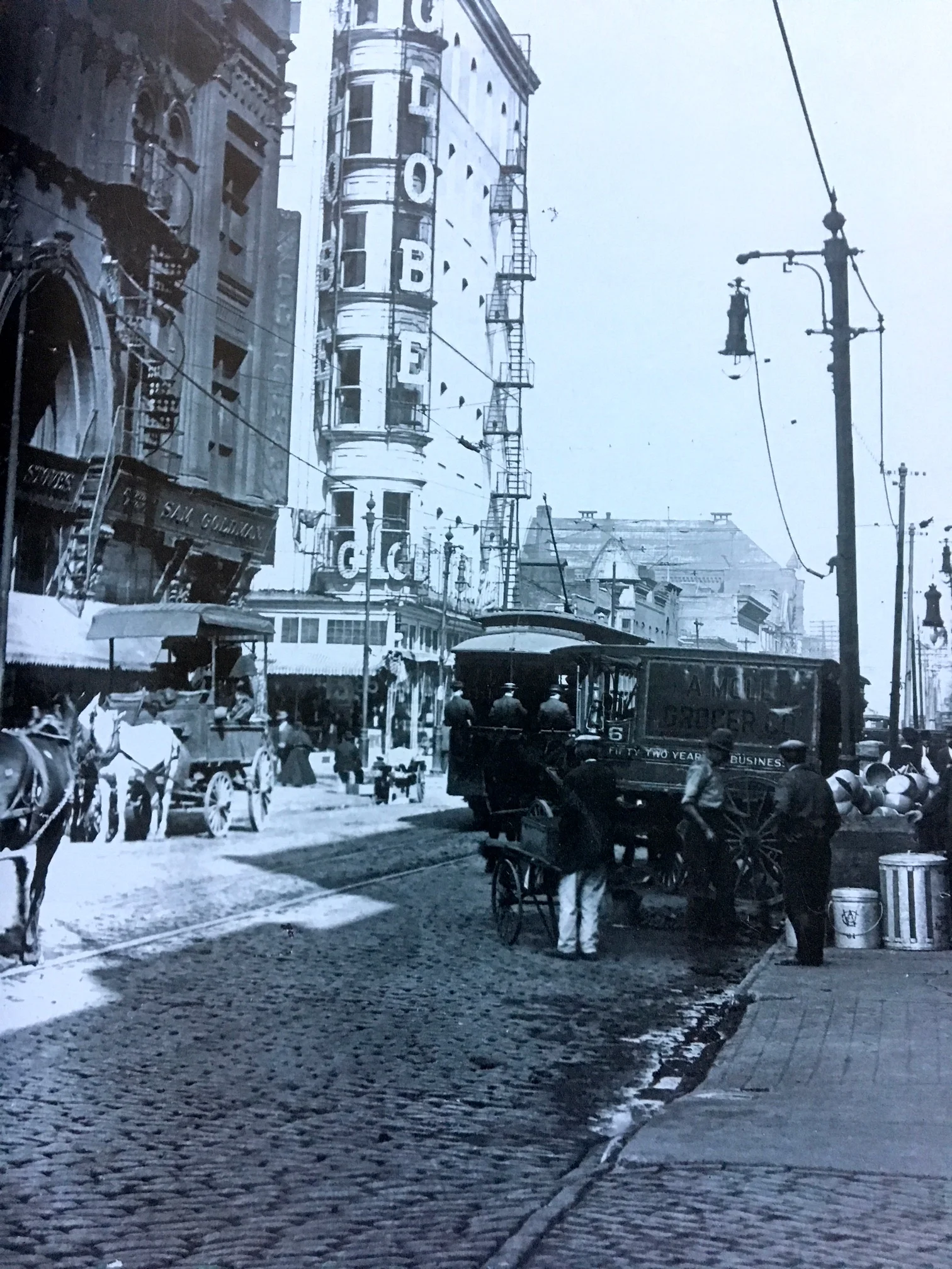 7th Street looking north across Franklin Avenue, ca. 1900. The Globe Theater at 719 Franklin Ave and St. Patrick's School and Hall are in the background - photo source: "Capturing the City"