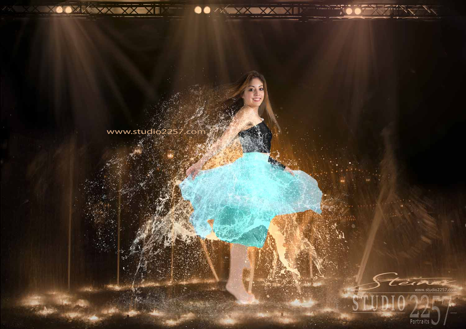 studio photo of teenage girl dancing in water fountain