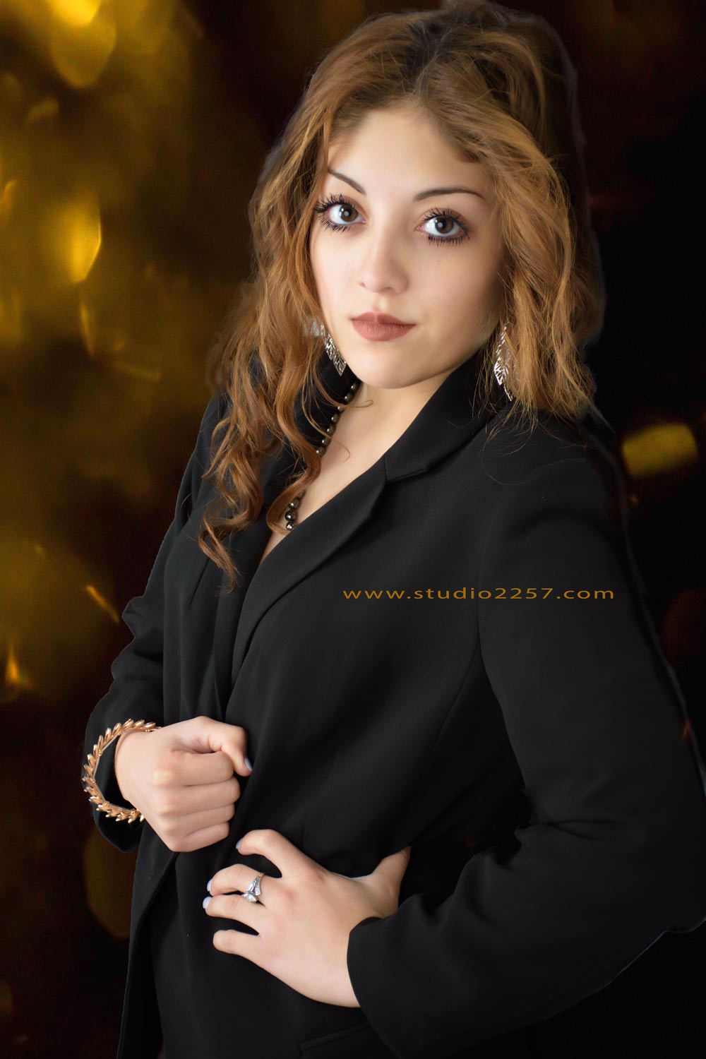 senior photography of girl in black jacket
