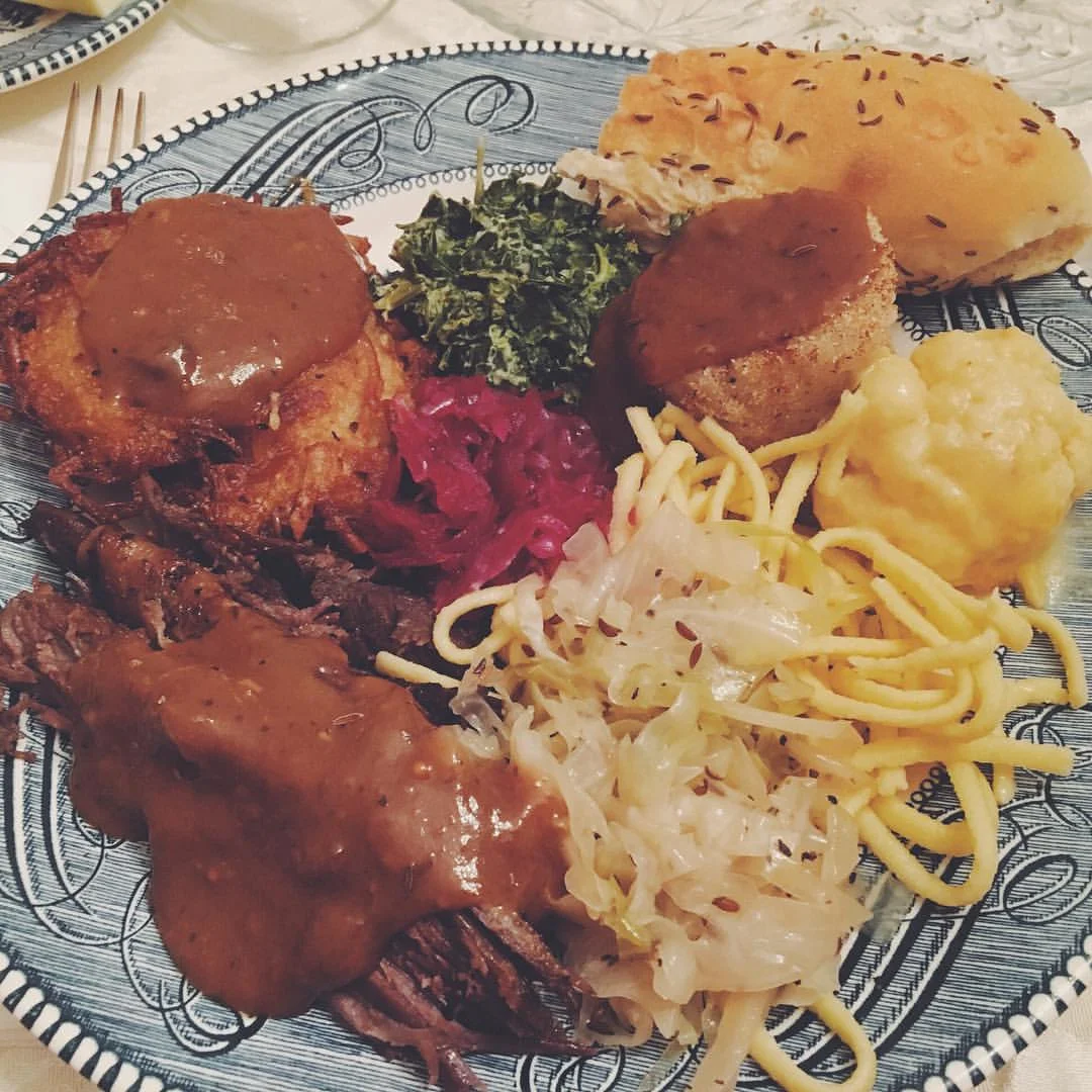 A big plate of love. Sauerbraten, sweet & sour cabbage, red cabbage, spatzle, latke, creamed spinach, potato dumplings, baked cauliflower. 