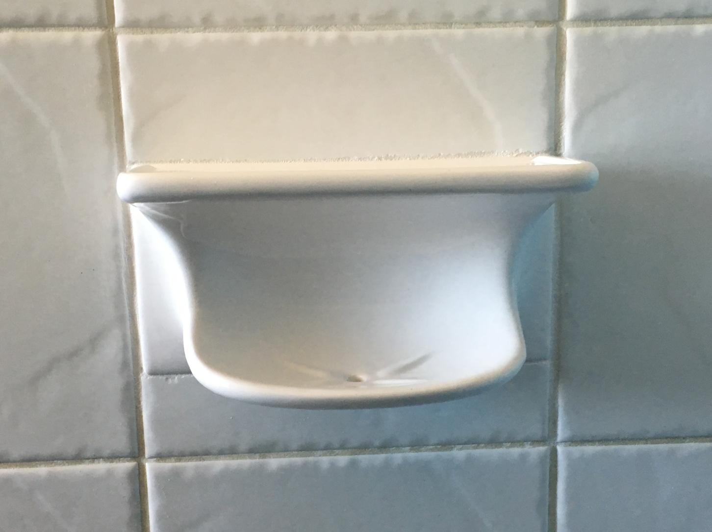 New soap dish set into tiles and re-grouted