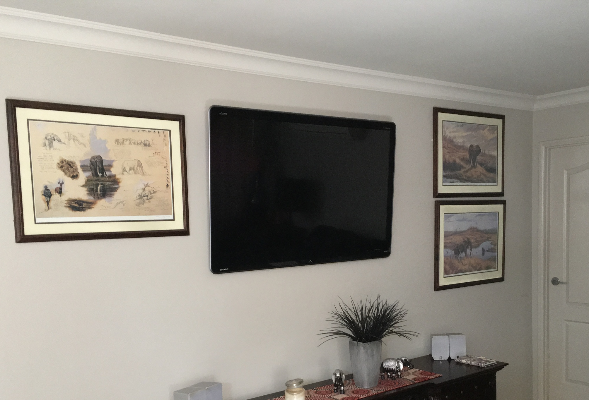 Large TV mounted to a cavity wall in a home in Highfields, when the TV cables have been run in the wall behind the plaster board.