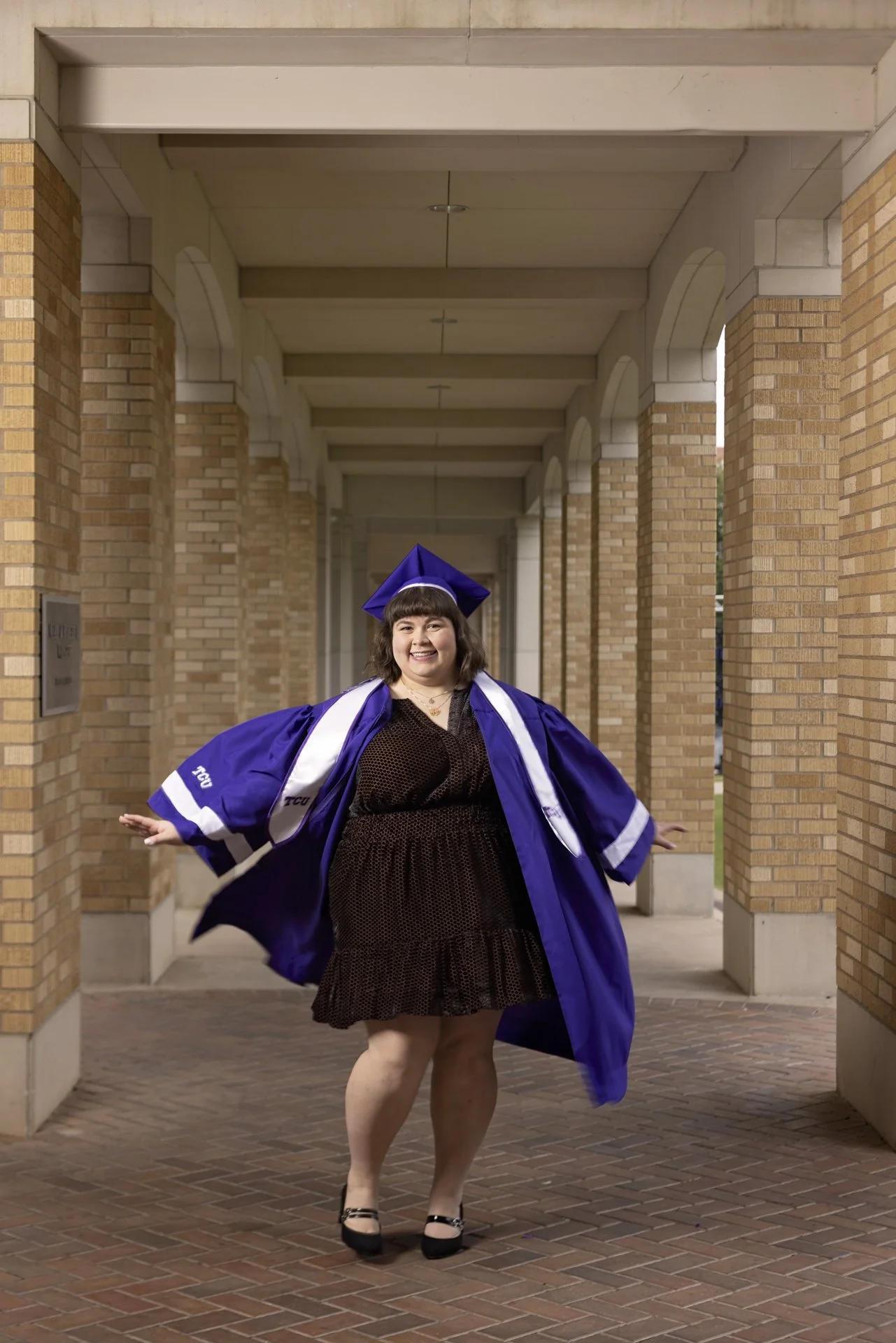 tcu-campus-arches-graduation-portrait.jpg