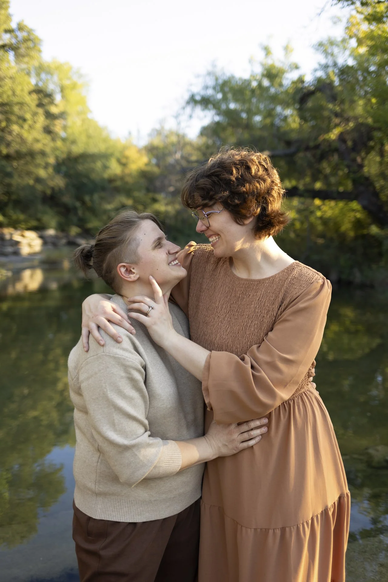 lgbtq-couples-creek-embrace-portrait.jpg