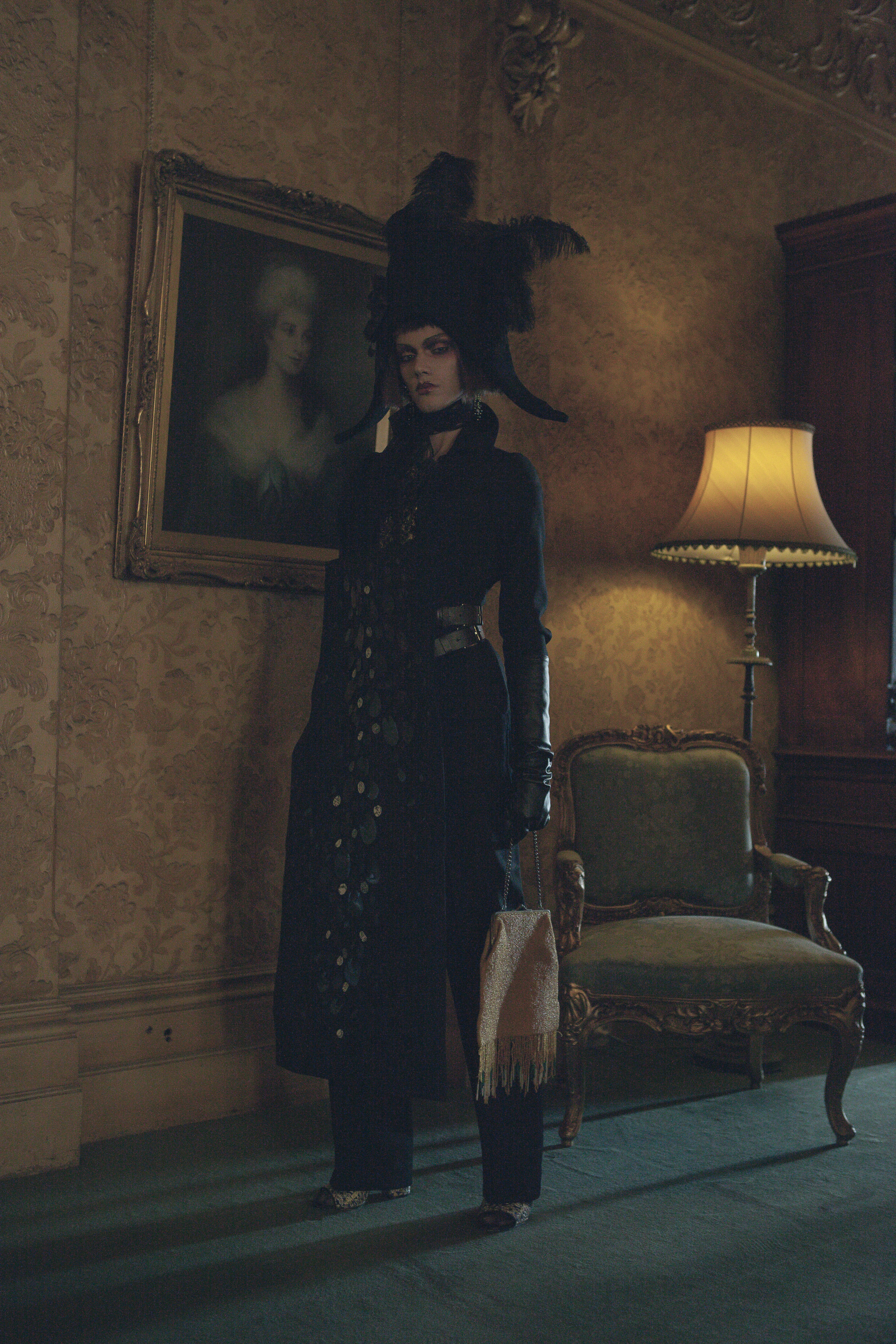 Curtis wears Anastasia La Fey oversized Bicorn handcrafted from wool/cashmere, antique Victorian taffeta ribbon, antique Edwardian trim & vintage ostrich feathers with Sarah Hope Schofield jacket & embellished faux belted panel over 1920s dinner pants & beaded purse from the National Trust Victoria archive