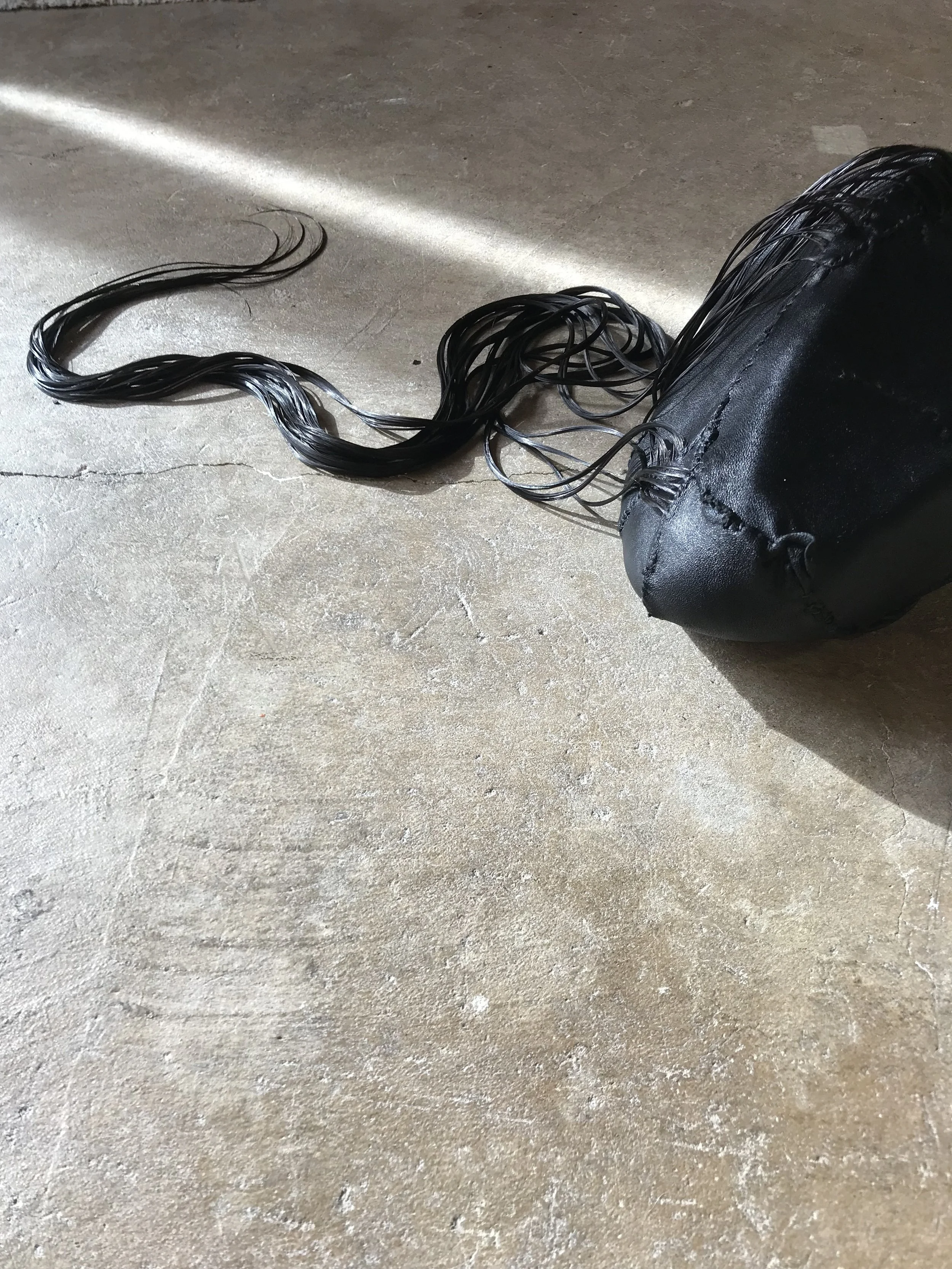 (ABOVE) TERRATOMA 3# : studio investigations/experimentations 2019 : EARTHWORKS river rock, leather, bonded thread, human hair, glycerin (BELOW) TERRATOMA #1