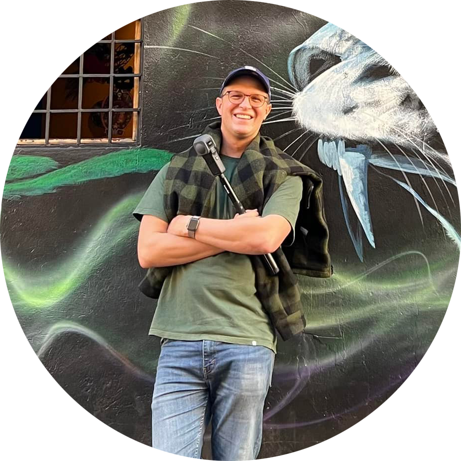 Scott Cardwell holding 360 camera and smiling at the camera